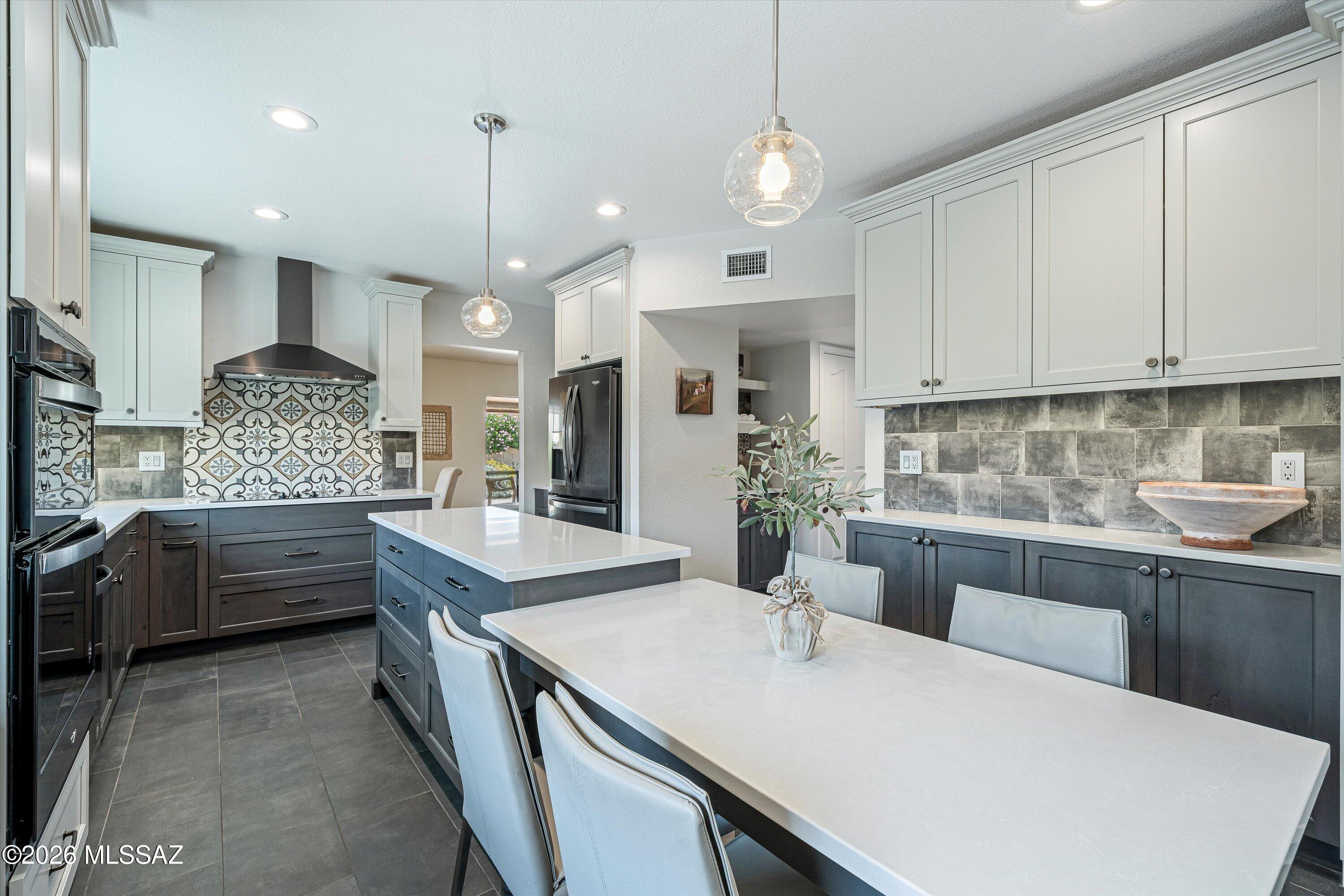 Move-in ready and beautifully remodeled, this Alameda model offers 3 bedrooms, 3 bathrooms, with the flexibility to use the third bedroom as a den or home office. Turnkey furnishings are available on a separate Bill of Sale. Thoughtfully updated with high-end finishes, this home features a stunning kitchen with two-tone cabinetry, 42-inch upper cabinets with crown molding, pull-out shelves, and a dramatic double two-tier island perfect for entertaining. The remodeled bathrooms include spacious walk-in showers, complemented by updated flooring, fresh interior paint, LED lighting, and stylish ceiling fans throughout the home. Enjoy Arizona outdoor living on the extended patio with electric rolling shades for year-round comfort. A new roof underlayment installed in 2026 includes a transferable warranty for added peace of mind. The professionally landscaped backyard was updated in 2025 and includes a raised garden bed ideal for growing fresh vegetables and herbs. The welcoming front courtyard is the perfect place to enjoy your morning coffee while watching the sunrise over the mountains. Located in SaddleBrooke, Southern Arizona's premier active adult community, you'll enjoy world-class amenities including golf, pickleball, tennis, fitness centers, swimming pools, restaurants, clubs, arts, and endless opportunities for an active lifestyle. This professionally remodeled home is truly move-in ready and offers the perfect combination of luxury, comfort, and resort-style living. Don't wait to come see it today!