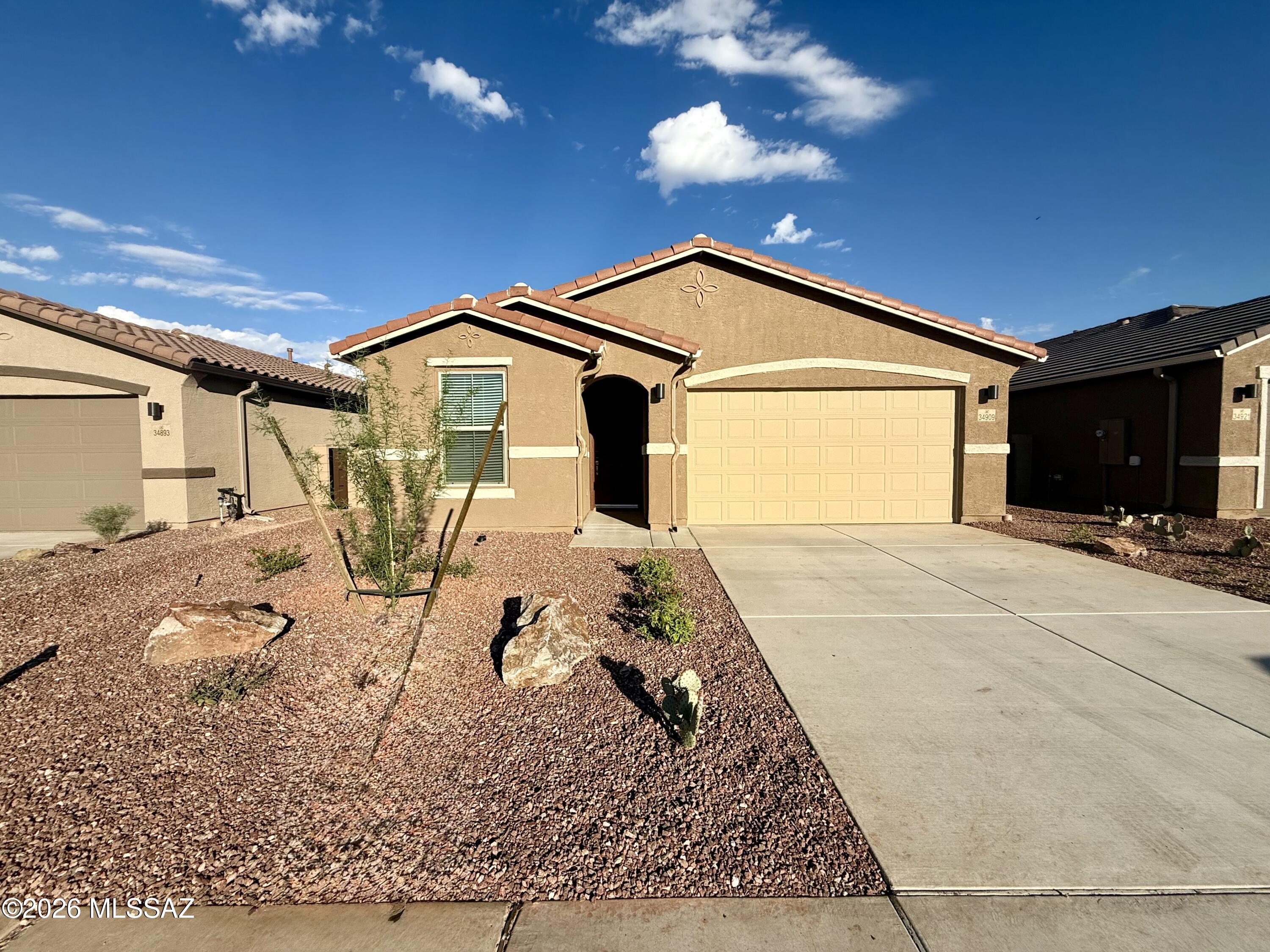 1,230 SQ FT! 3 bedroom, 2 bath home located in Red Rock's Red Rock Village neighborhood. This desirable single-story floor plan offers a comfortable layout with open living spaces and plenty of natural light.

The charming kitchen comes equipped with included appliances: AC unit, dishwasher, dryer, microwave, oven, refrigerator, and washer. Enjoy spacious living areas that are perfect for relaxing or entertaining family and friends.

This home features carpet and tile flooring in all the right places. The primary suite includes a walk-in closet, and all three bedrooms are nicely sized for comfort and flexibility. Step outside to a backyard retreat with a fenced yard, grassy area, and covered patio -- ideal for outdoor gatherings or quiet evenings. A 2-car garage provides added convenience and storage space.

Located in the desirable Red Rock Village community, residents enjoy access to great amenities including a community pool, playgrounds, and biking/walking trails. Excellent Red Rock location near schools, parks, dining, and entertainment!