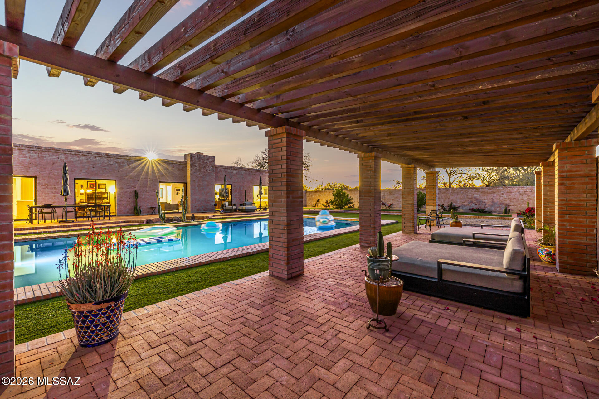 Welcome to the epicenter of Tucson Modernism. This iconic sanctuary, originally designed by the legendary Arthur T. Brown, has been masterfully reimagined by acclaimed youthful designer Casey Smith. Set within the coveted Colonia Solana subdivision, this residence is a masterclass in blending mid-century soul with 21st-century sophistication: a reimagined legacy. While the design honors Brown's signature use of light and desert-responsive geometry, the current owners have elevated the restoration to a curated level of excellence. The meticulous updates include all-new wiring and plumbing, ensuring the infrastructure is as flawless as the aesthetic. Features of this desert oasis include soaring steel-framed windows and a warm wood ceiling creating a seamless indoor-outdoor relationship. A newly bricked pool, expansive patio, custom Ramada, and outdoor shower cabana provide year-round entertaining options.  With the complete mechanical overhaul you can enjoy the territorial mystique without the maintenance concerns of a vintage build. This is more than a home; it's a preserved piece of architectural history, optimized for the modern connoisseur.