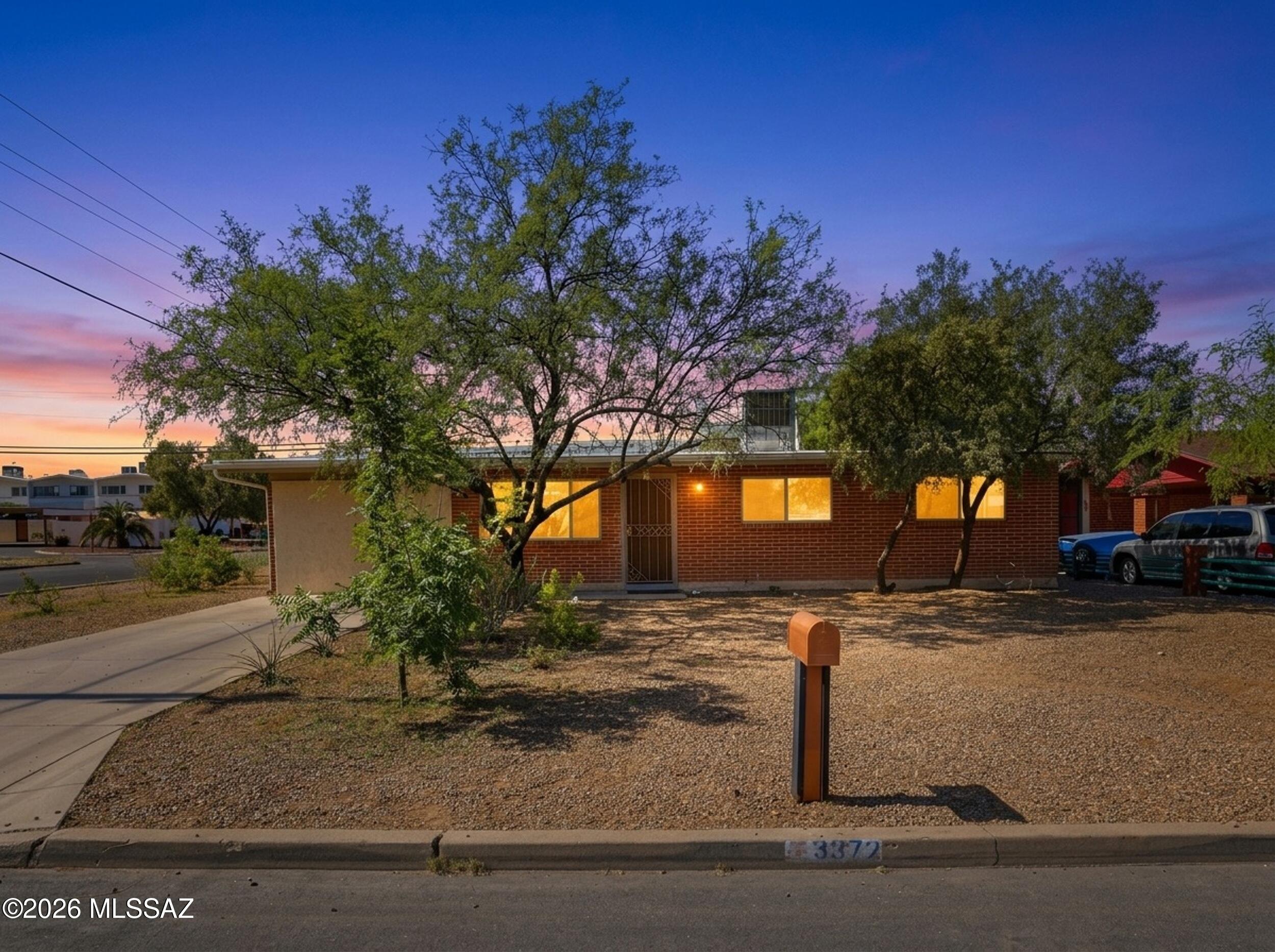Welcome to this well-maintained 4-bedroom, 2-bath home located in Tucson's established Lorena Homesites neighborhood. Built in 1965 and offering approximately 1,352 square feet of living space, this single-story residence features a functional floor plan designed for comfortable everyday living. The spacious living room flows into a dedicated dining area and kitchen, creating an inviting space for gathering and entertaining. Ceramic tile flooring throughout provides easy maintenance and durability.
The home includes four generously sized bedrooms, including a primary suite with a private bath. The kitchen offers ample cabinet and counter space and comes equipped with a dishwasher, disposal, electric range, microwave, and pantry storage. A separate utility room adds convenience for laundry and additional storage needs.
Situated on an approximately 8,059-square-foot lot, the property features a fully fenced yard with mature landscaping, decorative gravel, shrubs, flower beds, and a sprinkler/drip irrigation system. A covered patio provides a great space for outdoor relaxation. Conveniently located near parks, schools, shopping, dining, and major commuter routes, this property offers an excellent opportunity for homeowners seeking comfort, space, and accessibility in central Tucson.