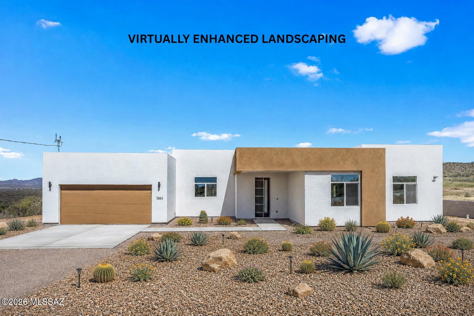 SELLER WILL CREDIT BUYER $5,000 TOWARDS LANDSCAPING! ONE of 2 residences by TAC Architects currently available in the area.

Experience effortless living in this thoughtfully crafted new construction home in Rio Rico, featuring a bright, open layout filled with natural light and a seamless flow throughout. 

Step outside to a peaceful outdoor setting with elevated desert views, ideal for relaxing or entertaining. Located just minutes from highway access, the home offers exceptional convenience while maintaining a quiet, tucked-away feel.