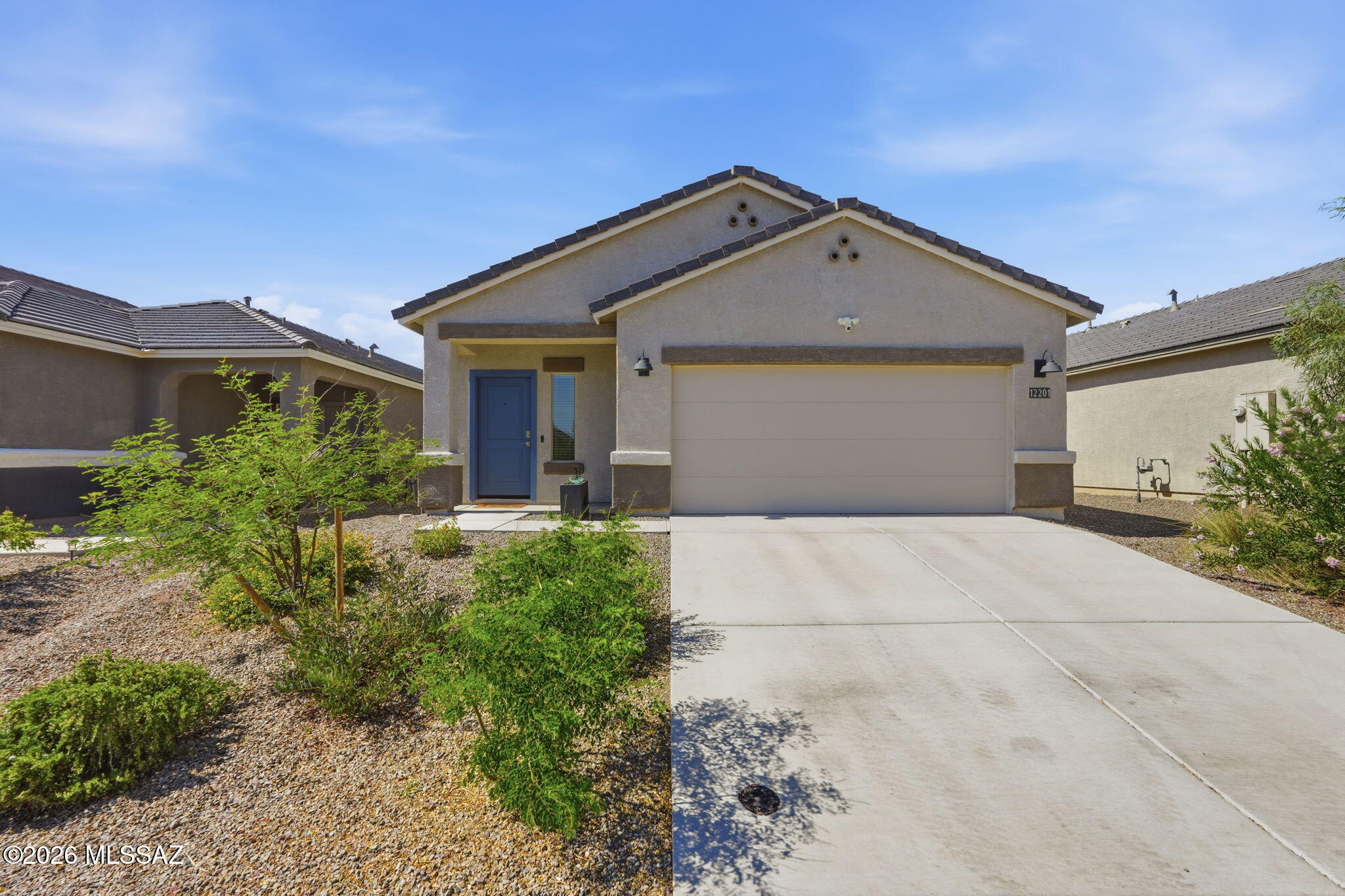 Move-in ready and impeccably maintained, this beautiful 3-bedroom, 2-bath home offers the perfect blend of comfort and convenience in the highly sought-after Vail Unified School District. Featuring stylish modern accent walls and a professionally landscaped backyard, this home is ready to enjoy from day one. Backing to a common area with beautiful native ocotillos and no rear neighbors, you'll love the added privacy and peaceful desert views. Ideally located with easy access to I-10, Raytheon, Davis-Monthan Air Force Base, plus nearby shopping and dining, you'll appreciate the convenience this location provides. Qualified buyers may also take advantage of the existing assumable VA loan, offering the potential for significant monthly savings.