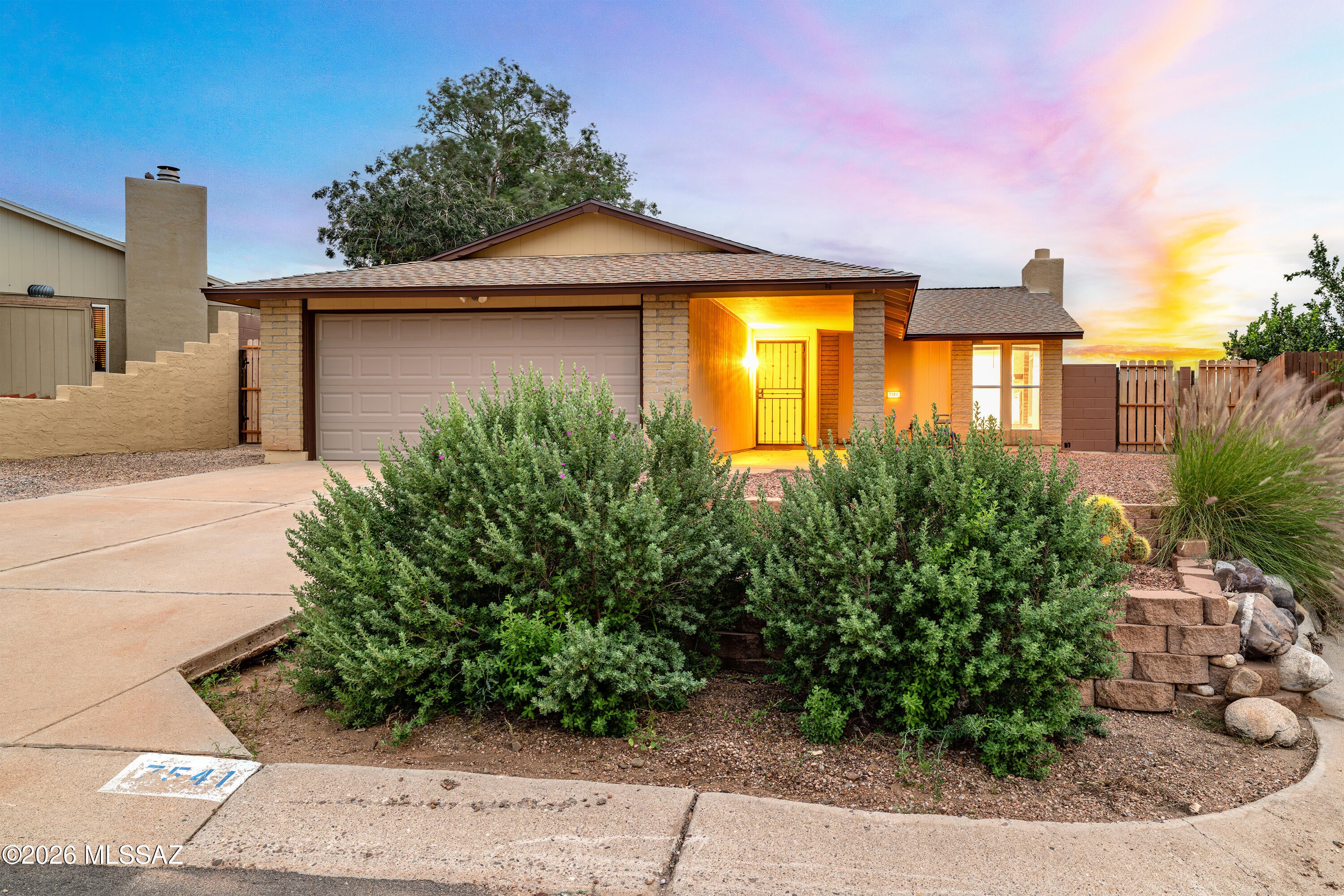 This Ranch Style home has been freshly painted with new flooring though out! Relax pool side in your freshly plastered below ground pool and enjoy the sunsets. Private back yard for relaxation from your covered patio. The kitchen has a small island that opens onto the family room with fireplace and dining area. Separate living room with new wood flooring. 3 nice sized bedrooms freshly painted with new carpet. Nicely updated bath rooms. Primary suite has sliding glass doors to the covered patio. Plus a nice 2 car garage. New roof and HVAC 2026.