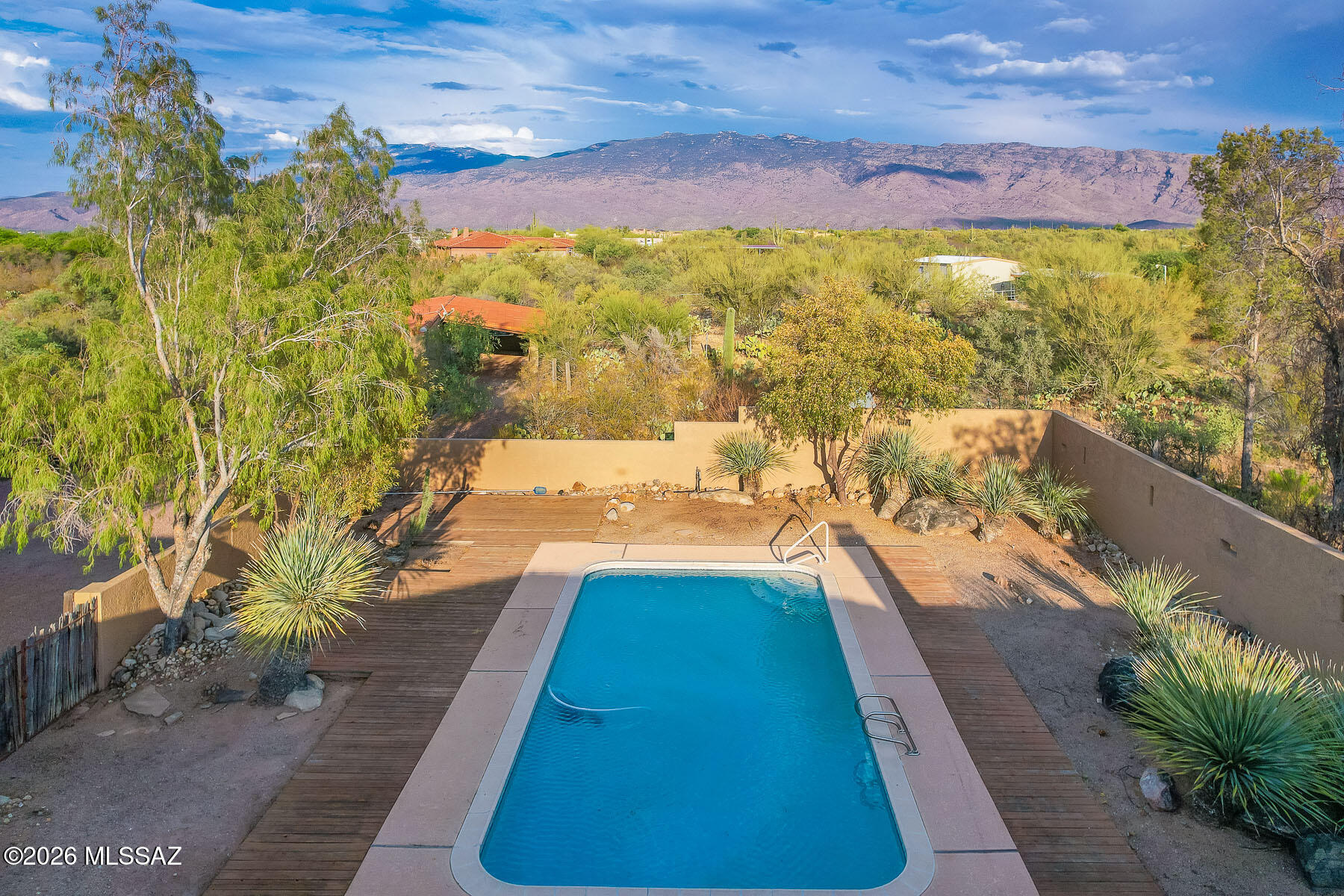 Estate Sale! Price Reduced! Seller will entertain offers in the range price. A Nature Lover's Paradise. Nestled on 3.6 private acres with wonderful mountain views, this sprawling Southwestern custom estate offers the perfect blend of tranquility and charm. The property features a 5,034 sq. ft. main residence with 6 bedrooms and 4 bathrooms, plus a 377 sq. ft. guest house.
Inviting great room showcases soaring beamed ceilings. Spacious primary suite offers a luxurious retreat with an oversized bathroom and walk-in closet. Saltillo tile floors and six fireplaces throughout. Bring the horses. Three 12' x 12' horse stalls. Enjoy the pool in the east-facing backyard! Two 2-car garages plus a 2-car carport. Newer TPO roof. See floor plan in documents. See More link for important information. Estate sale. The home is being sold As-Is. Sample of Estate Attorney's counteroffer is in attached documents. Call LA for details prior to making an offer.  

Please use Pioneer Title Agency. Desha K. Jackson 1660 East River Road Suite 150 Tucson, Arizona 85718 Office: 520.529.0700 Ext. 824 teamjackson@ptaaz.com. Title Commitment is in attached documents. 

Please note this spacious house and guest house on 3.6 acres needs updating, misc. electrical, plumbing and kitchen appliance repairs, guest house plumbing repairs, etc but is priced at only $184-$194 a sqft. Flex room not heated or cooled can be 6th bedroom with mini split added. 

There is a newer high-tech TPO and Tile roof on the main house. We are verifying that the warranty from Tovar Roofing is transferrable.  Over $50,000 in recent improvements include fresh interior and exterior paint, Saltillo tile refinishing, misc. repairs, etc. 

Floor plan and Title Commitment can be found in attached documents.

Invoices from recent improvements, HVAC inspections, roof reports will be added to attached document section. 

The home is located within the highly regarded Tanque Verde School District.