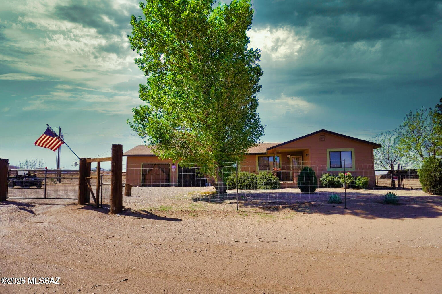Mini-Farm/Homestead. 3 BR/2BA frame built home on 2.57 acres. Detached one car garage/workshop with power and is insulated. Plus a 2 car garage attached to the home with lots of storage closets. Roof replaced in 2021. Property is fenced for horses or other animals. Has a barn. Property is also gated with an automatic gate opener. Landscaping trees are on drip irrigation. Walking distance to the Mustang Mall. Sunizona Water co. with a septic. Central gas heat and newer central AC. Washer and Dryer and refrigerator convey. Back yard is fenced for dogs. No CC&R's. No HOA. Video Tour avail on this listing. look for the link