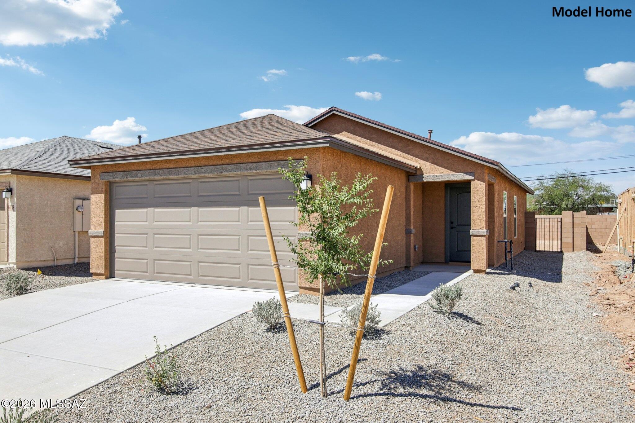 Located in a community with views of the Tucson Mountains, this single-story, 2-bedroom home features an open floor plan with abundant natural light, dedicated laundry space, and tile flooring throughout. The kitchen showcases poplar cabinets in choice of two colors, a peninsula, and Whirlpool® stainless steel appliances, including an electric range, vented hood over range, and dishwasher. The 2-car garage, kitchen pantry, hallway linen closet, and entry coat closet provide storage space. This is a floor plan listing. Home is to be built and buyer may choose features and homesites that are not included in this base price. Call today for more information. Base price range does not include lot premiums and/or additional upgrades other than included features.