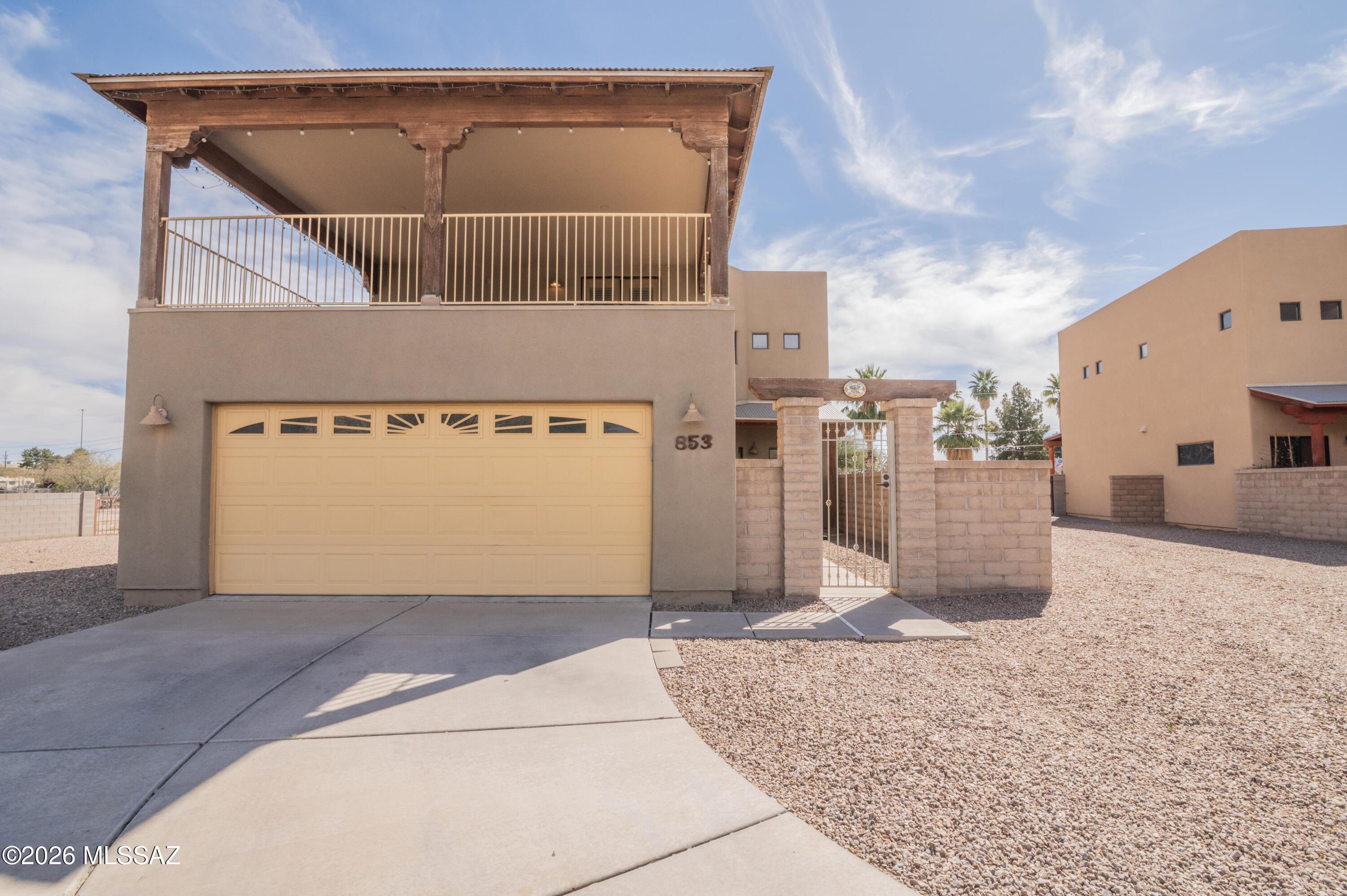 Gated community with quick access to University of Arizona, Pima Community College, Downtown Tucson, and the freeway. Corner lot next to common area with a spacious driveway and stunning ''A'' Mountain Views. Enclosed courtyard entry to a bright, open 3BR + office (could be used as a bedroom) & loft. (2,238 sq ft). Main level offers bedroom, full bath, and office. Upstairs boasts TWO private suites, each with its own full bath and oversized closet, plus a loft. Step onto the incredible covered balcony and soak in sweeping ''A'' Mountain sunsets! Kitchen with granite, pantry, breakfast bar opens to family room and covered patio. An amazing opportunity to make this house your home!