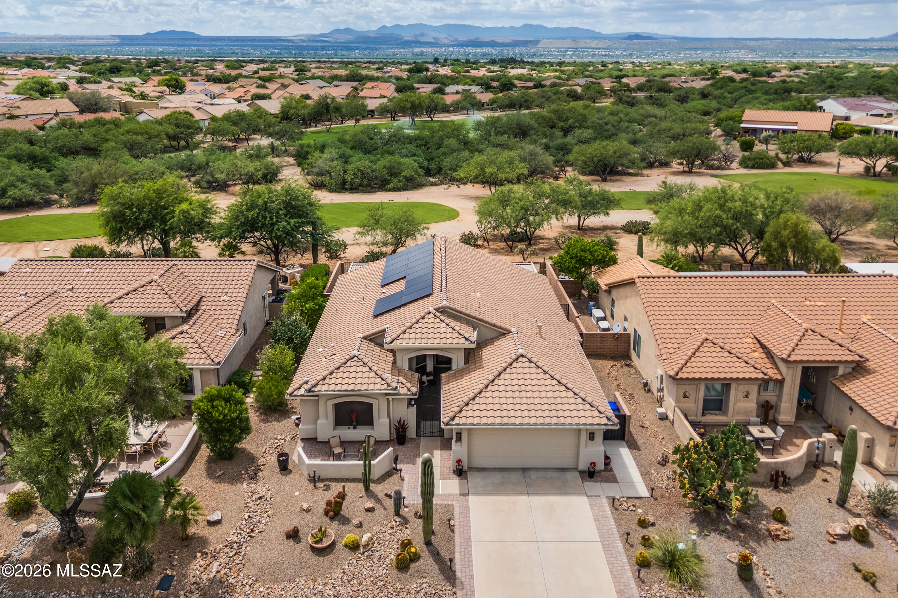 Experience the Quail Creek lifestyle in this stunning, extensively remodeled Heritage model overlooking the 5th hole of the Coyote course. Offering 1,624 sq. ft., 2 BR, 2 BA and a Den, this turnkey home has been transformed inside and out--no surface has been left untouched. Improvements include new flooring, new kitchen and baths, all new windows, doors and lighting throughout, a new HVAC system (2021), new roof in 2023, OWNED SOLAR, and redesigned front and rear outdoor living spaces. An inviting front courtyard offers a peaceful place to relax and enjoy Santa Rita Mountain views. Beyond the courtyard, a gated entry leads to the front door. Inside, the home's contemporary design comes to life with ceramic tile flooring throughout, high ceilings, clerestory windows and 5-inch baseboards. The spacious great room provides exceptional flexibility for living, dining and entertaining. The fully remodeled kitchen features two-tone cabinetry with 42-inch uppers, quartz countertops, tile backsplash, center island with pendant lighting, newer stainless appliances and a gas range. The owner's suite enjoys golf course views, direct patio access and two closets, including a walk-in. Its remodeled bath offers dual vanities and an all-tile walk-in shower. The guest bedroom also includes a walk-in closet, while the remodeled guest bath features an all-tile shower. A den near the entry is ideal for a home office or quiet reading retreat. The extended-length 2-car garage includes epoxy flooring, storage cabinets, a utility sink and side service door.

Outdoor living is equally impressive, with an extended paver patio, ramada, electronic roll-down shade screens and a misting system providing welcome relief from the afternoon sun. Set on a premium golf course lot with no rear neighbors, the home offers exceptional privacy, sweeping fairway views and an ideal setting for enjoying the Quail Creek resort lifestyle.
