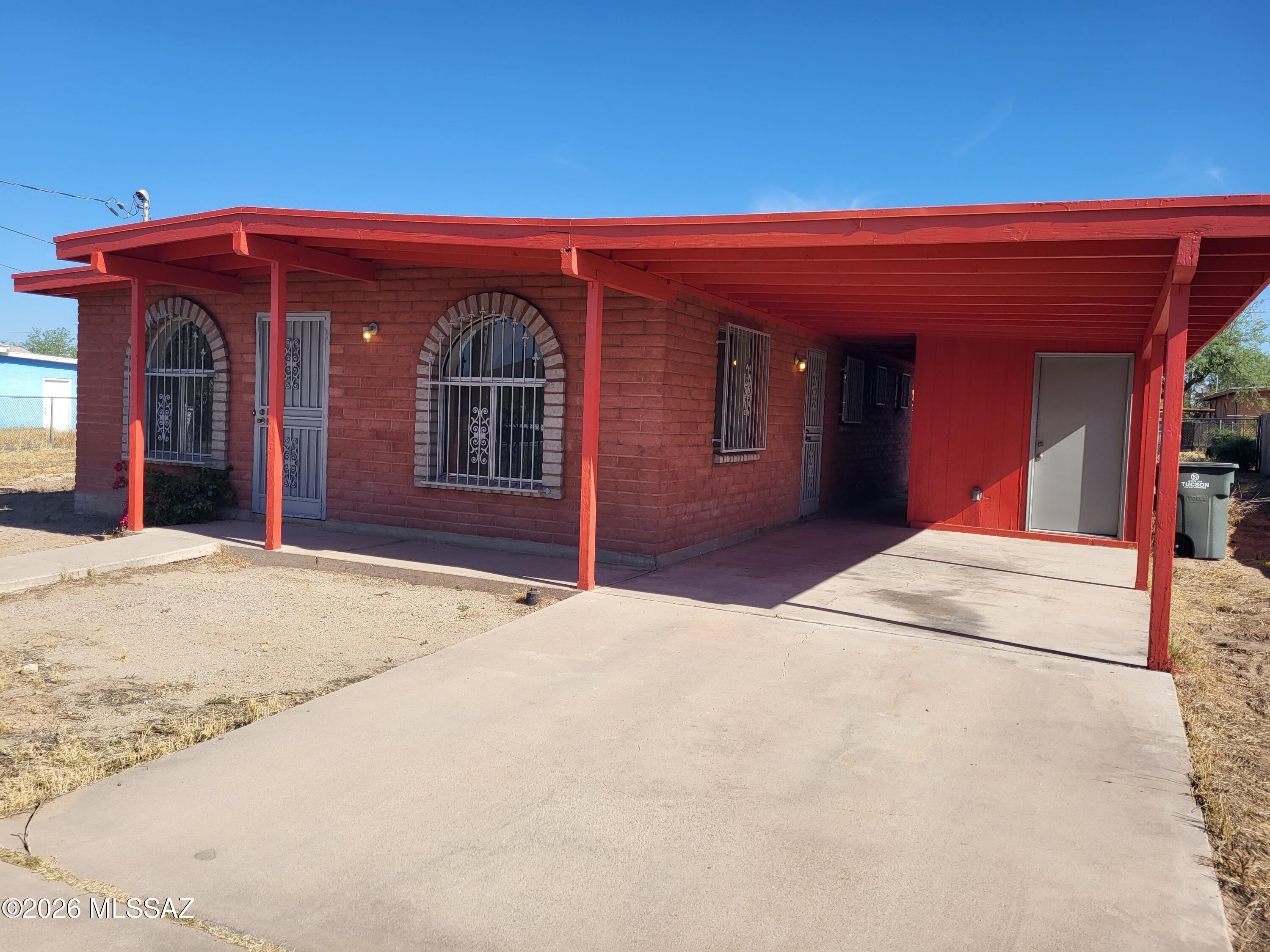 Solid red brick 4-bedroom, 2-bath home built in 1991 and kept in great condition, offering space, flexibility, and rare added value with two parcels included. The home features a large living room plus a spacious great room, giving plenty of room to spread out, gather, or entertain. Zoned Tucson R-2, the additional vacant parcel opens the door to future building possibilities, expansion, or investment potential. Conveniently located with quick access across town and close to shopping, restaurants, parks, and the casino, this is a unique opportunity with room to grow in a well-situated Tucson location.