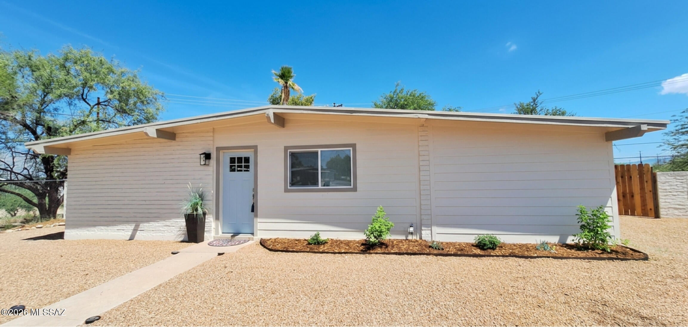 Beautifully reimagined 3-bedroom, 2-bath home with 1,530 sq. ft. of bright, turnkey living space. Renovated from top to bottom, it showcases new electrical, new flooring, fresh interior and exterior paint, updated fixtures, and contemporary finishes throughout. The open, inviting layout offers easy everyday living and a natural flow for entertaining. Enjoy mountain views and exceptional privacy with no rear neighbors, plus a spacious backyard featuring a storage shed and double side gates for convenient access. Added peace of mind comes with warranties on the roof, HVAC, water heater, and all appliances. Move-in ready and designed to impress its next owner.