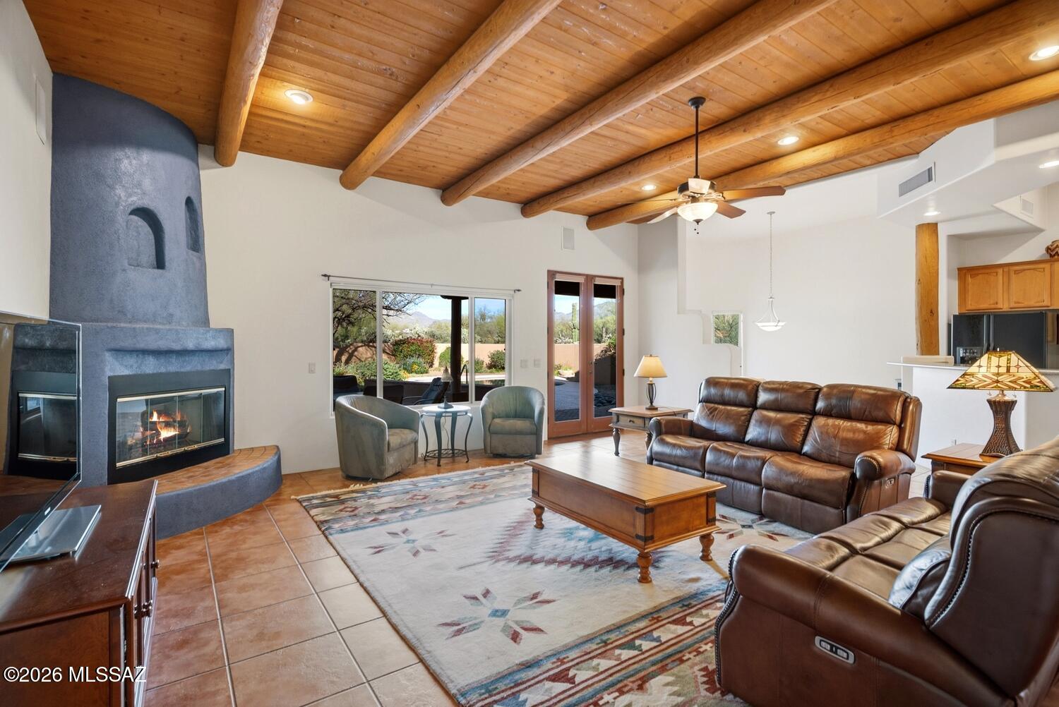 Tucked in on a cul de sac lot in a small gated enclave of semi-custom homes, this Southwestern home is the perfect place to enjoy all the Sonoran Desert has to offer. A fantastic great room design with exposed Vega beam ceilings, floor to ceiling kiva fireplace,  and windows that perfectly frame the Catalina Mountains & manicured backyard.  Look out onto colorful vegetation, a heated pool, covered patio & built in bbq. Primary suite is expansive with patio access, large bathroom with walk in shower, soaking tub, and double closets. Additional bedrooms and bathrooms are perfect size. Oversized 3 car garage has room for everything. Pride of ownership is evident throughout which makes this home a true turn key.