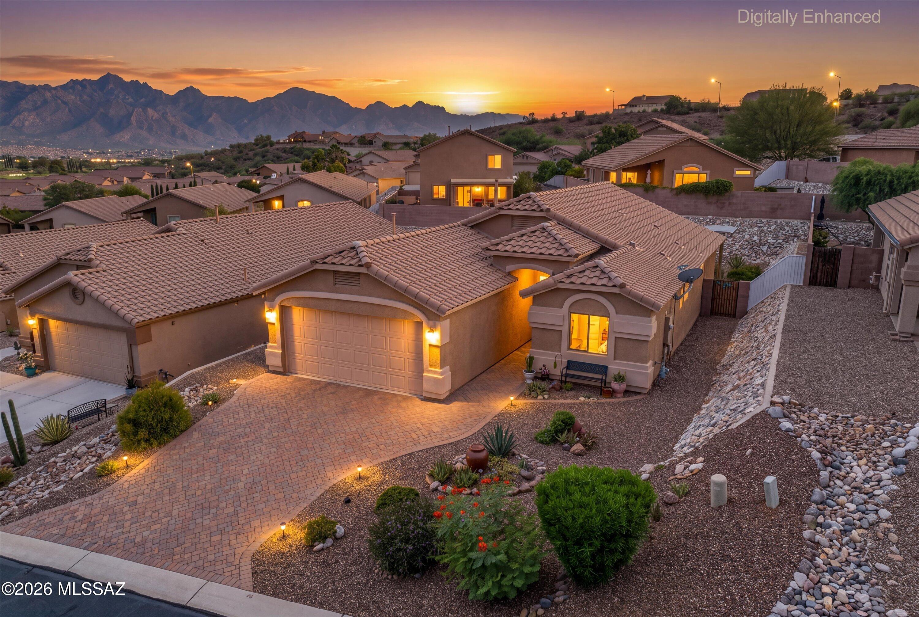 DON'T MISS THIS GEM WITH GORGEOUS MOUNTAIN VIEWS! Meticulously maintained & turn-key in Catalina, nestled near Oro Valley, Oracle & Catalina State Parks and Honeybee Canyon Park.  Arrive via a paved driveway & walkway to a secure screened entrance. Inside, enjoy a thoughtfully designed Great Room floor plan with tile flooring throughout and a private split-bedroom layout. Step outside to your private backyard featuring a brick paver patio extended under a gorgeous pergola, complete with desert plantings and an updated drip irrigation system (2023). The spacious, fully block-walled yard offers stunning views of the Catalina Mountains. Clean, pristine (no shoes worn indoors), and perfectly situated near outdoor trails. In documents, see Floor Plan, Special Features & Utility Costs. Eagle Crest Park has a basketball court, picnic area & play structure.