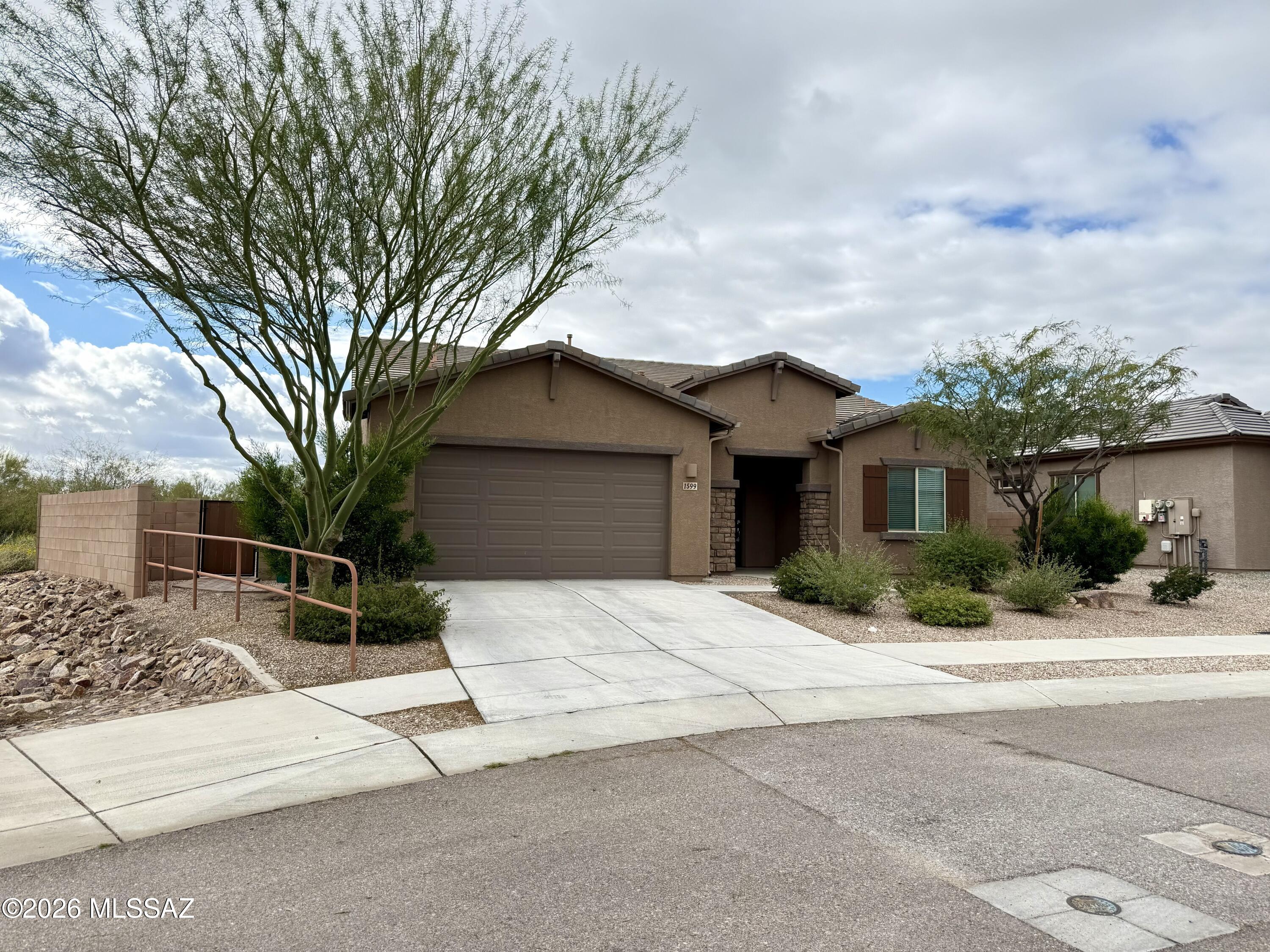 Spacious 4-bedroom, 3-bath home located in Oro Valley. This well-maintained home features a light and open floor plan with comfortable living spaces throughout. The large backyard includes pavers and low-maintenance turf, ideal for outdoor enjoyment. The home is equipped with a water softener, and washer and dryer are included for added convenience. Generously sized bedrooms offer flexibility for guests or a home office. Conveniently located near shopping, dining, parks, and schools. Pets upon approval. NO CATS Krasnick realty represents landlord only on this listing