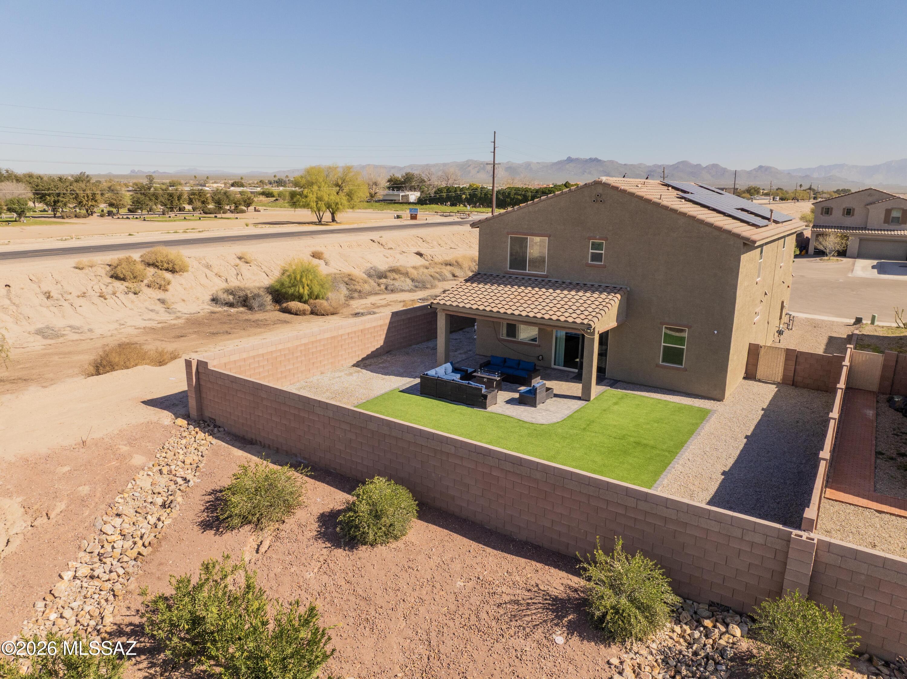 Situated on an extremely rare premium cul-de-sac lot with no rear or side neighbors! Better than a new build - with nearly $100,000 in upgrades during and after the build. Built ONLY 2.5 years ago with 2,920 sqft, 5bed, 4bath, (2 Primary Bedrooms) One primary guest wing w/ en-suite downstairs. Kitchen offers marble-look white quartz countertops, gas range, large island, reverse osmosis at sink, & dark slate cabinetry. Wood-look tile flooring flows through the main level leading to the beautiful landscaped backyard with easy maintenance decorative turf & gravel. Enjoy the extended pavers from the covered patio with ceiling fan, misters, mounted TV, perfect outdoor living and entertaining.
Head upstairs to the large loft for even more living space, 4 additional bedrooms laundry room with sink and upper & lower cabinetry. The main primary suite offers a walk-in shower, dual sinks at vanity and massive walk-in closet! DP Energy Star windows, spray foam and cathedral attic insulation (R-19), dual-level zoned heating and cooling and solar saving thousands on utility bills. Whole home water softener system and Smart features: smart thermostat, smart garage door opener, smart entry lock, ceiling fans with remotes and smart capability, and a security system with cameras. Extended 3-car garage offers multiple possibilities for workout area, workshop or space for all your cars / toys, plus hanging overhead storage. Easy access to I-10, shopping, dining, parks, splash-pad and many community events. See home "Features and Upgrade" sheet for even more!"