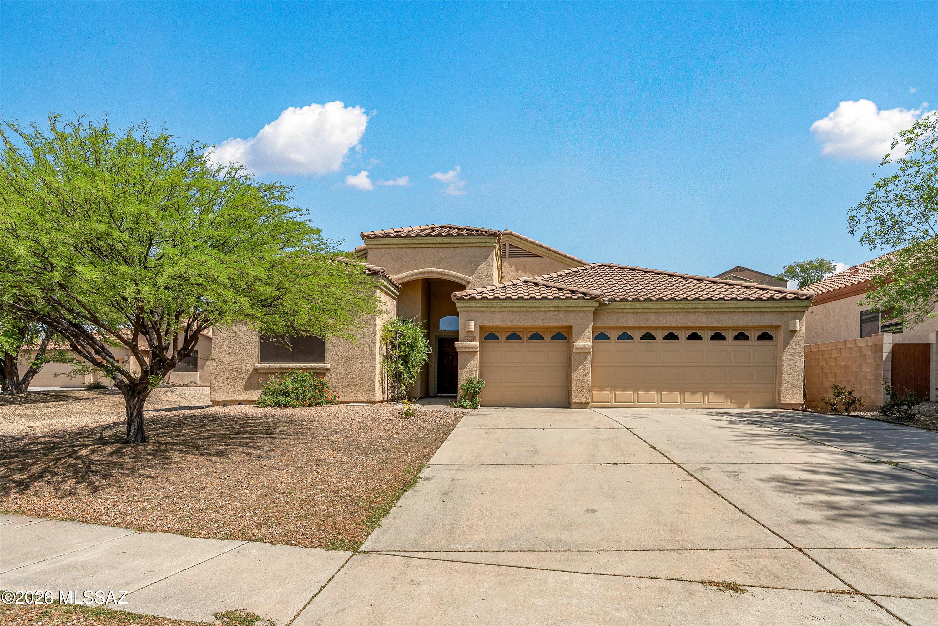 Beautiful 4-bedroom home in the desirable gated community of Rancho Del Lago! Nestled near the end of a quiet cul-de-sac on a large lot with a 3-car garage. This home offers privacy, space, and an open layout with plush carpeting, neutral tile flooring, and tasteful finishes throughout. The eat-in kitchen is perfect for entertaining. Includes stainless steel appliances, custom cabinetry, granite countertops, a decorative tile backsplash, and a center island with a raised breakfast bar. The primary suite is a true retreat, complete with a private exit, a large walk-in closet, and a spa-inspired bathroom featuring dual sinks, a garden tub, and a separate shower.  Enjoy AZ living at its finest in your private backyard oasis with a covered patio, pool and no neighbors behind.