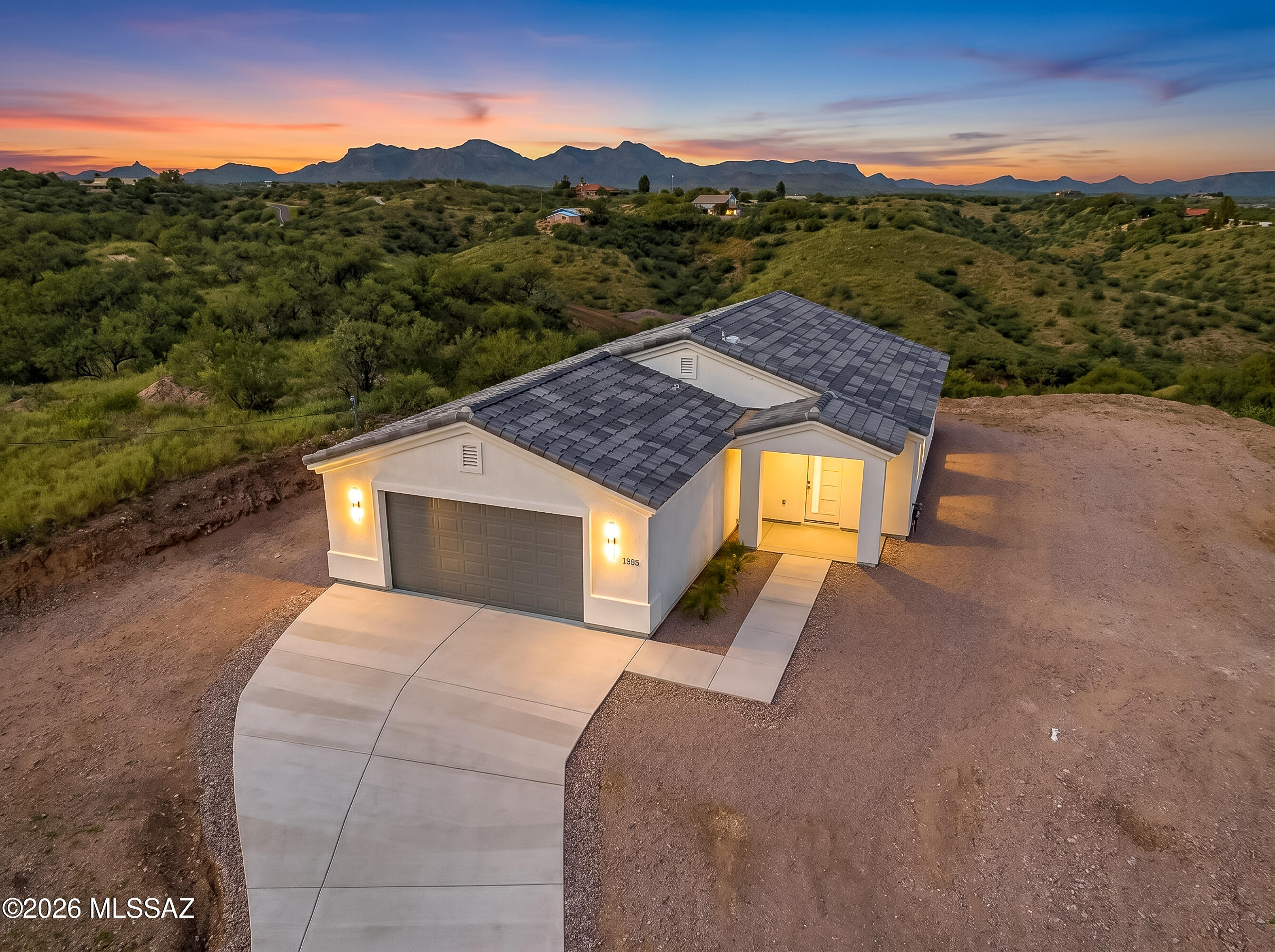 Experience privacy, quality, and breathtaking 360-degree views in this beautifully crafted 1,522 sqft new construction home, situated on a spacious 0.67-acre lot. Built by a trusted local builder, this home showcases exceptional craftsmanship and a designed floor plan that blends comfort and functionality. At the heart of the home is a stunning kitchen featuring handcrafted cabinetry, thoughtfully designed to provide both beauty & functionality while adding a distinctive custom touch. The living area features a striking chimney, while the tile roof adds lasting beauty & durability. A dedicated laundry room with built-in shelving provides convenient storage, & the garage is finished with a sleek epoxy-coated floor. Surrounded by incredible scenery this quality new build delivers detail.