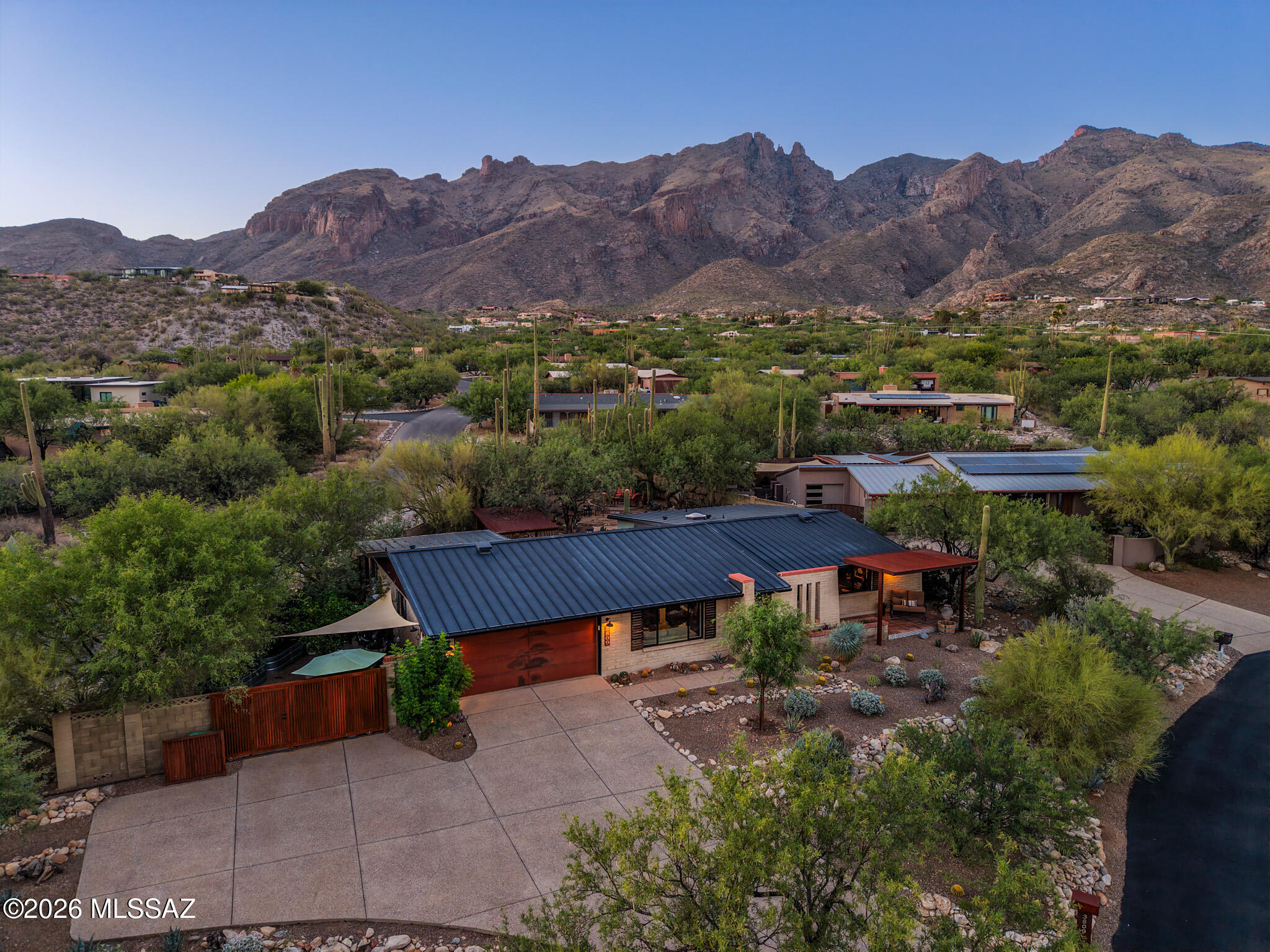 Wonderful Catalina Foothills home!  This modern classic home was completely remodeled by a local builder in 2020. On an elevated lot, situated for maximum privacy, city views from front and mountains to rear. Landscaping is native and well-maintained. Rebuild took the house down to foundation, with emphasis on creating a sense of spaciousness and light. New plumbing, electric, HVAC, doors, windows and roof. Floor is concrete overlay throughout. Master suite is stunning. Separated guest room. Existing office could convert to a fourth bedroom w/addition of a closet. All energy-efficient appliances and excellent insulation for low utility costs. Western side yard has mature citrus and gardening boxes with timer-irrigation installed.  Rare & amazing opportunity here in the Foothills! Truly one of a kind opportunity.  No details left undone.  Home was expanded with new foundation in the rear to allow for a large master suite looking up to the Catalina Mountains.  Huge windows allowing all the Arizona light in.  West side yard with mature citrus and gardening boxes.  Terraced backyard - a modern oasis in the desert.  All energy-efficient appliances and excellent insulation for low utils!