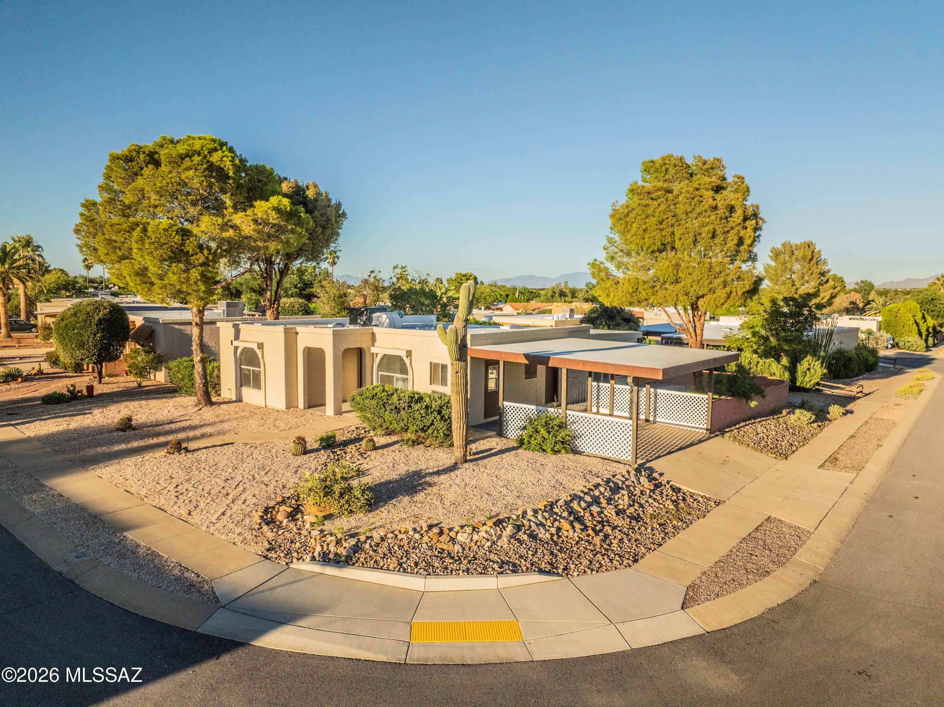 **A MUST-SEE** Beautiful, turn-key remodeled 2/2 corner lot home with an optional Arizona room, large den, or office. YOU CHOOSE. This captivating home features brand new stainless-steel appliances, new cabinetry, new quartz countertops, new luxury vinyl plank flooring throughout and new bathrooms.  Enjoy relaxing mountain views from the courtyard or your Arizona room. GVR property. Ready for the new owner to call this their home!!!