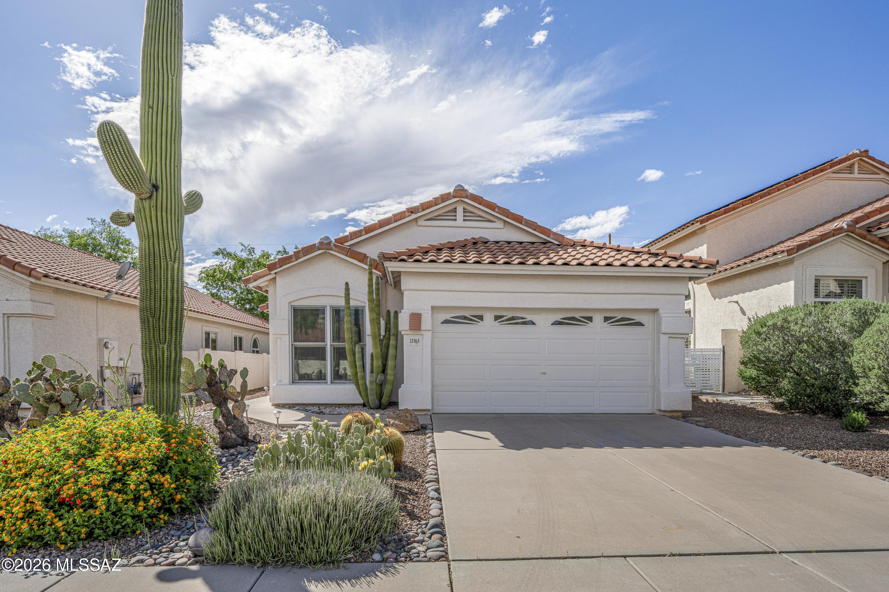 Fabulous home in the heart of the Rancho Vistoso Community. Loved and well maintained. Luxury Vinyl Planks throughout. Updated kitchen with granite countertops and custom pull outs for storage (also in lazy Susan and bathrooms). Two nicely upgraded and updated bathrooms, with the primary bathroom with a walk in jetted tub and walk-in shower.  Three wonderful bedrooms with the third one made into a home office with built-ins (can be easily be removed)! ! Extended patio has epoxy floors. Oasis-like backyard with mature trees and lots of beautiful shrubbery.  All windows from 2020 with built in blinds.  HVAC also from 2020! Garage has epoxy floors and extra storage! Save on your electricity with solar panels!