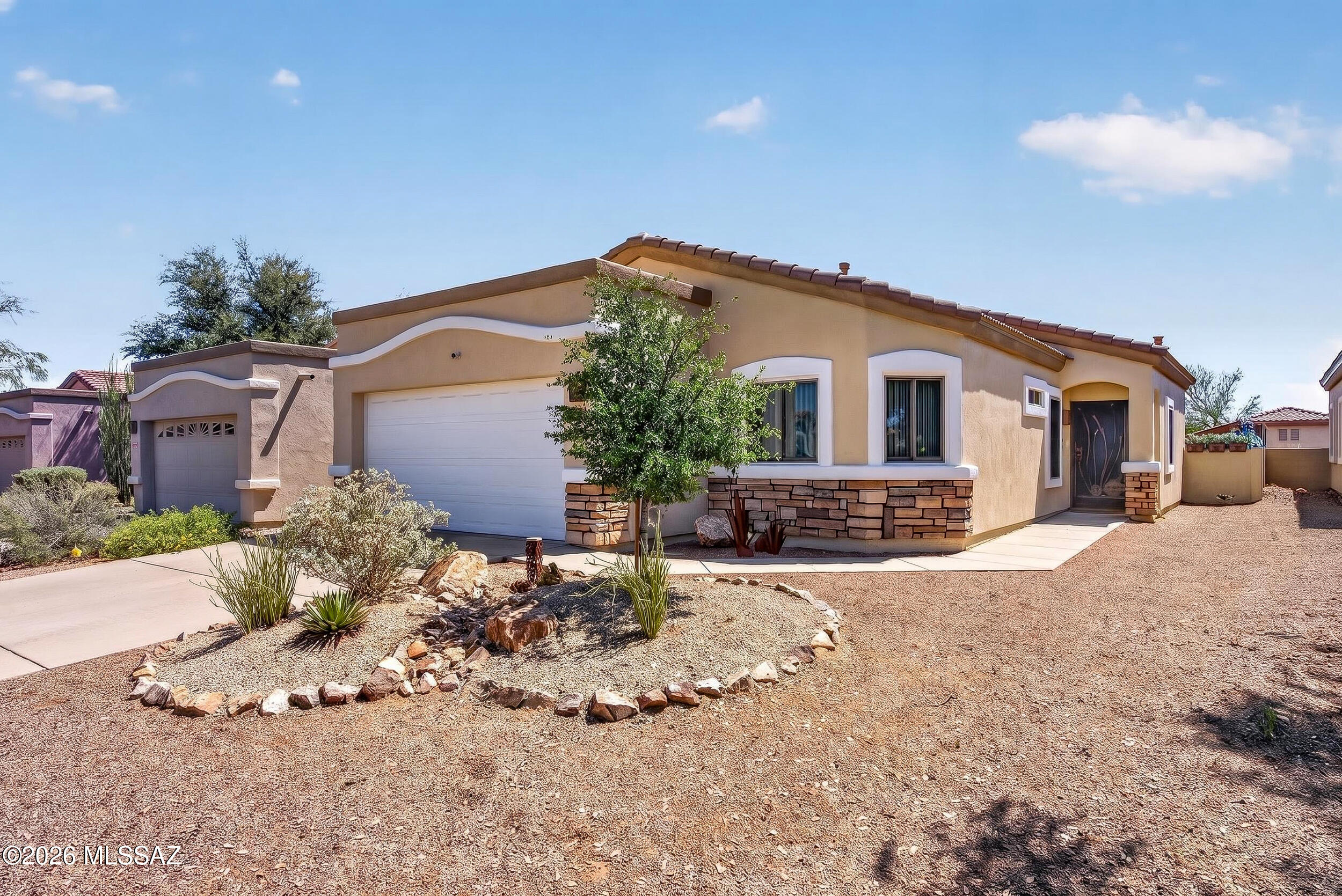 Move-in ready gem!! Beautifully updated w/~$80k+ in upgrades: new HVAC (2021), exterior paint+decorative stone (2022), extensive windows & doors, new water heater (2022), garage door (2023). Low-maint desert landscaping w/front yard island, enhanced irrigation, raised block walls, decorative gravel, covered/uncovered paver patios w/ceiling fan & custom security door. Inside: LVP wood-look flooring (no carpet), custom window treatments (2025), chef-ready U-shaped kitchen w/refinished cabinets, granite counters, farmhouse sink, gas range & subway tile backsplash, gas FP w/reclaimed wood feature, luxurious Owner's Suite w/barn door, remodeled spa bath w/frameless shower, soaking tub, double vanity & laundry cabinets w/shelf (2024). Resort-style community amenities await! SEE UPGRADE SHEET!!!