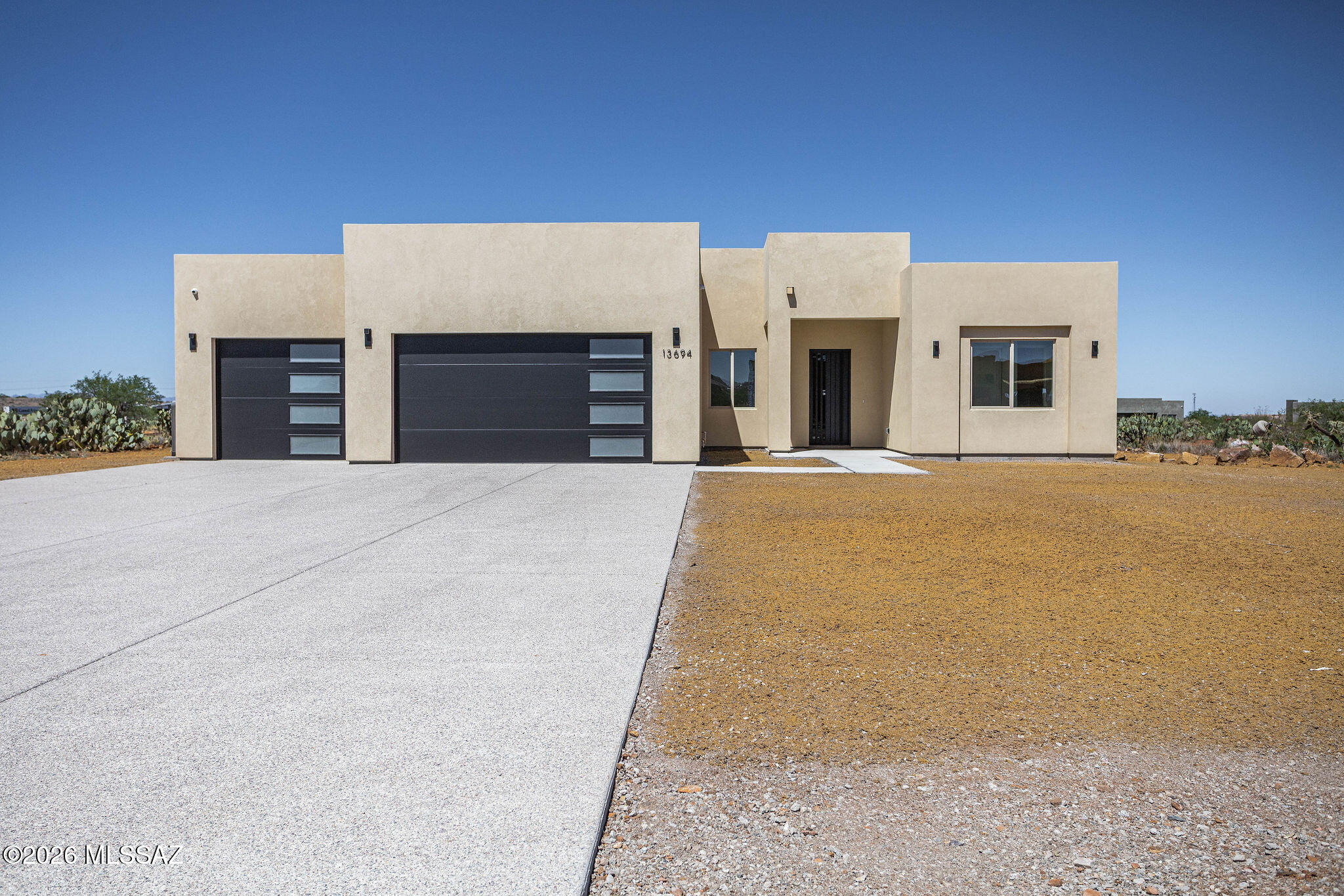 Range Price 745,000-760,000. Brand-new custom home built in 2026 with top-of-the-line finishes, exceptional craftsmanship, and a modern design throughout. Situated on an expansive 40,000+ sq. ft. lot, this stunning property offers space, quality, and efficiency--built to last. The impressive curb appeal features an oversized exposed aggregate concrete driveway with room for multiple vehicles, modern garage doors, and an oversized 3-car garage with an extension for larger vehicles. A striking 8' decorative wrought iron entry door welcomes you inside. The open-concept floor plan showcases 12' ceilings in the main living areas and 10' ceilings throughout, creating a bright and spacious feel. A 12' sliding glass door provides seamless indoor-outdoor living and opens to the oversized covered patio with concrete extension--perfect for entertaining. The home also includes dual-pane Low-E windows, foam insulation, slump block construction, and synthetic stucco exterior for superior energy efficiency and durability.

The gourmet kitchen is truly spectacular, featuring custom cabinetry with crown molding, soft-close drawers and cabinets, decorative hardware, and beautiful pendant lighting over the oversized island with seating for up to five and additional storage. Quartz countertops, an undermount sink, double spray faucet, and walk-in pantry complete the space. High-end stainless steel appliances include a French door refrigerator, restaurant-style hood with custom cabinetry, 5-burner gas range with griddle, double oven with 12 knobs, pot filler, dishwasher, and built-in microwave.

This spacious home offers 5 bedrooms and 3 bathrooms with a thoughtful layout. The luxurious bathrooms feature floating vanities, gold fixtures, framed mirrors, sliding glass shower doors, tile surrounds to the ceiling, upgraded lighting, and executive-height toilets. Additional highlights include a large laundry room with overhead cabinetry and utility sink, top-of-the-line lighting fixtures inside and out, security cameras, and high garage ceilings.