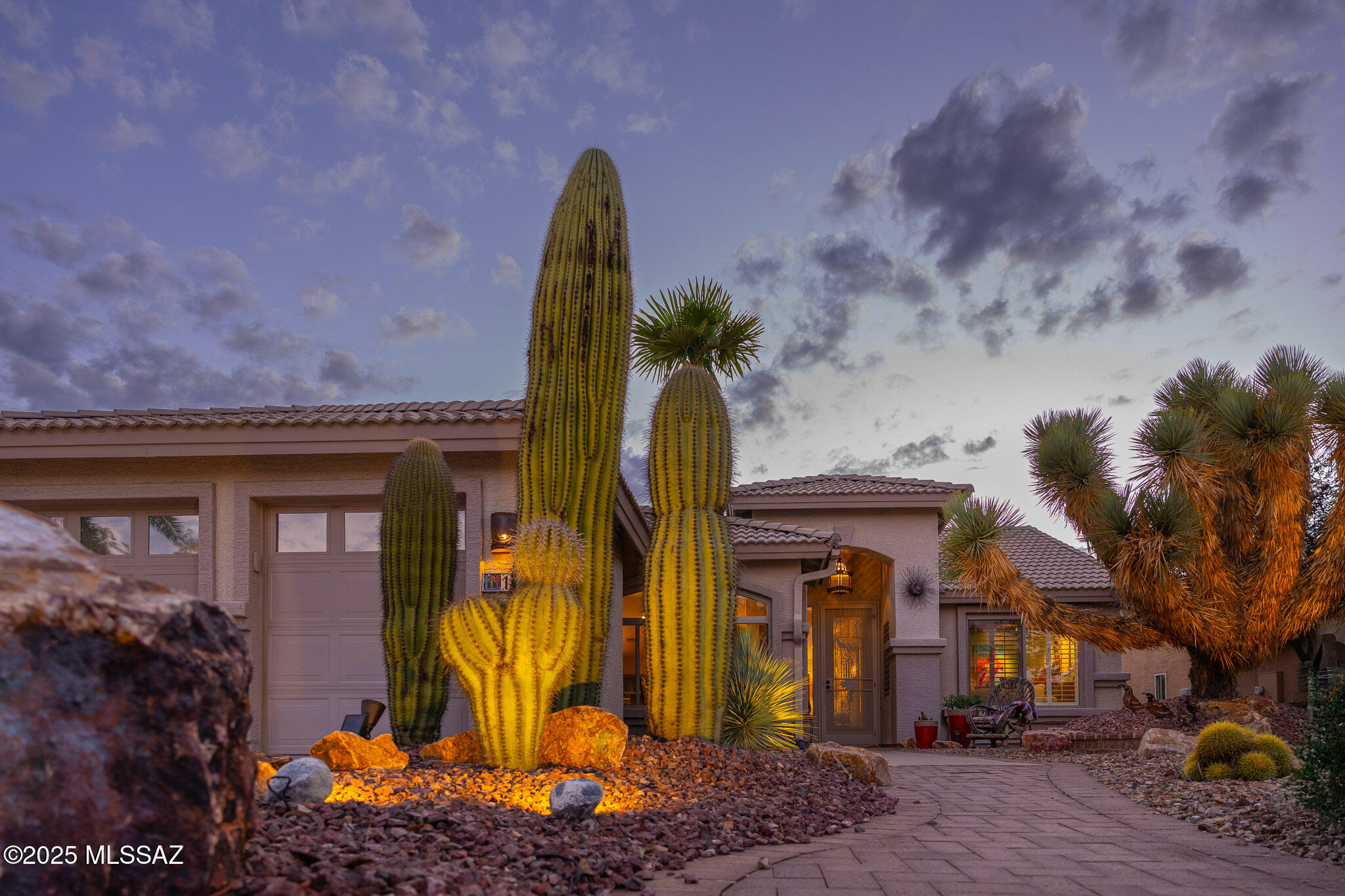 Experience the beauty of desert living in this beautifully updated home located in Quail Creek community. 

Seller financing is available with acceptable terms!!

 Perfectly positioned on a premium lot overlooking the golf course and mountains, this property offers views and unforgettable Arizona sunsets, complemented by striking desert landscaping in both the front and back yards, including a beautiful Joshua tree that adds to the home's unique charm.

Inside, you'll find a thoughtfully renovated kitchen featuring quartz countertops, soft-close cabinetry, a new sink and faucet, induction range, new backsplash, and a new dishwasher. The primary suite offers a refreshed bathroom with new quartz countertops, dual sinks, modern fixtures, updated mirrors, lighting, and a new toilet. The guest bathroom has also been tastefully renovated, providing a cohesive and updated feel throughout the home.

Additional upgrades include fresh interior paint, updated ceiling fans, and a remodeled laundry room complete with a newer washer and dryer.

Step outside to the covered patio, where freshly cleaned and sealed Saltillo tile creates the perfect space to relax or entertain while taking in the sweeping golf course and mountain views.

The extended 2.5-car garage is a standout feature, offering built-in cabinetry, a workbench, and even a golf cart.

This home truly captures the essence of Arizona living with its exceptional views, thoughtful upgrades, and serene setting.

Furniture is available for purchase under a separate bill of sale.