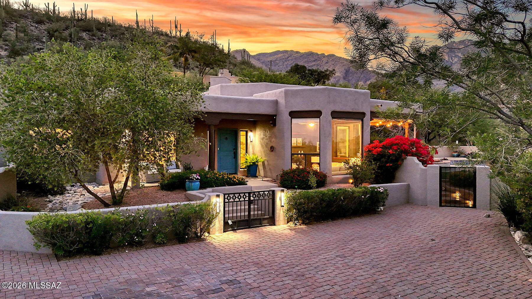 That rare home that is the perfect blend of inviting, perfectly designed, (think 360 views at every turn!) and most importantly a casual elegance throughout. The feeling of inside/outside living exemplifies the outdoor lifestyle with an abundance of patios, pool and spa, and even an area of turf.  Keep in mind that all of this is framed by amazing views of the mountains and even the city lights. Nestled up on a cul-de-sac in the heart of the foothills sits this find .  Flexibility?  The 5th bedroom (with french doors) is also amazing for an office or den.  The 3 car garage with electric car charger provides both room and storage.  I have been doing this for 30 years and when a home comes around that embraces what Tucson is all about, trust me and go see it.