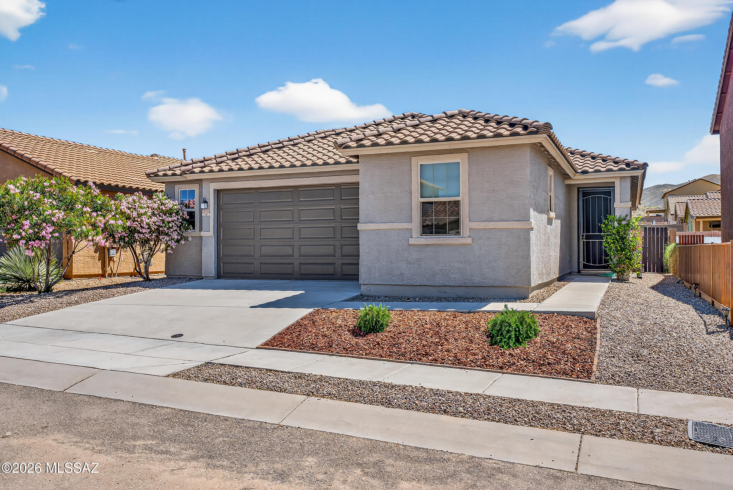 Better-than-new 3BD/2BA home w/office/den, on a premium cul-de-sac lot in desirable Vail AZ! Freshly painted interior with neutral finishes create a refined move-in ready retreat. Wood-look tile floors, & open-concept great room seamlessly connects to the gourmet kitchen w/granite island featuring breakfast bar & pendant lighting, rich wood cabinetry, gas cooktop, SS appliances & closet pantry. Spacious owner's suite offers walk-in closet & private bath w/large walk-in shower. You'll love the spacious 2.5-car garage w/extra width! Low-maintenance backyard boasts expansive paver patio, decorative rock area & view fencing backing to common area/wash w/no rear neighbors + spectacular mountain views. Award-winning Vail School District, low HOA, near park & walking trails. SEE VIDEO!!