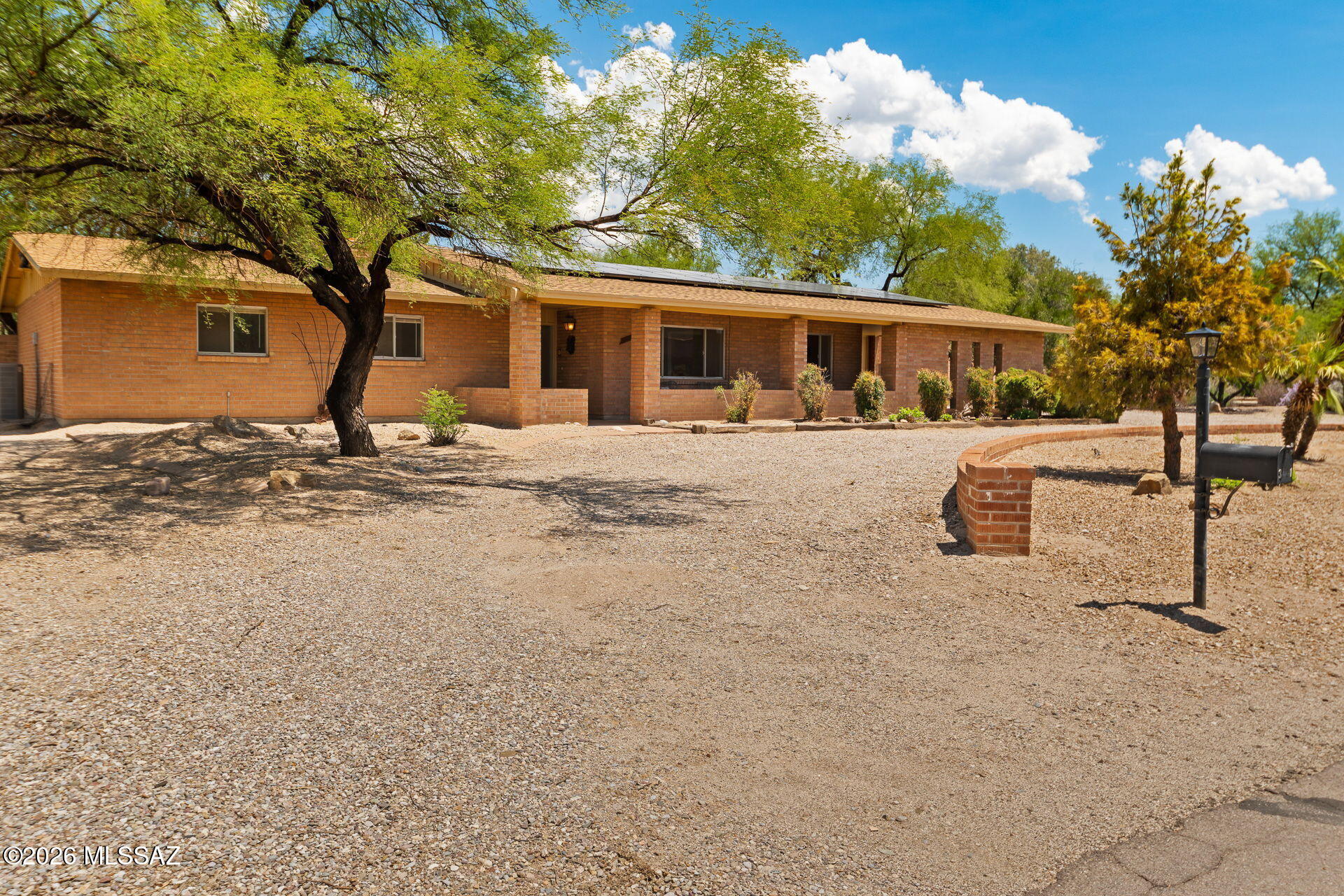 Ranch on the River! Come see all the possibilities of owning a well built brick home off Riverbend Circle on Tucson's North side of town. With direct access across the street to a River walk and community pool, there is no better location! This 4 bed/ 3 bathroom home is equipped with a Brand New Shingle Roof, Solar, New AC (in last 2 years) & Updated master bathroom.  Easy flow floorplan is ready for your ideas to make this the perfect forever home for anyone! Not to mention 2 ensuite bedrooms with baths!  Low care yards, fully fenced backyard with garden beds and full length covered patio. Enjoy mountain views from your backyard.  Come see the best deal in the area and make it yours!