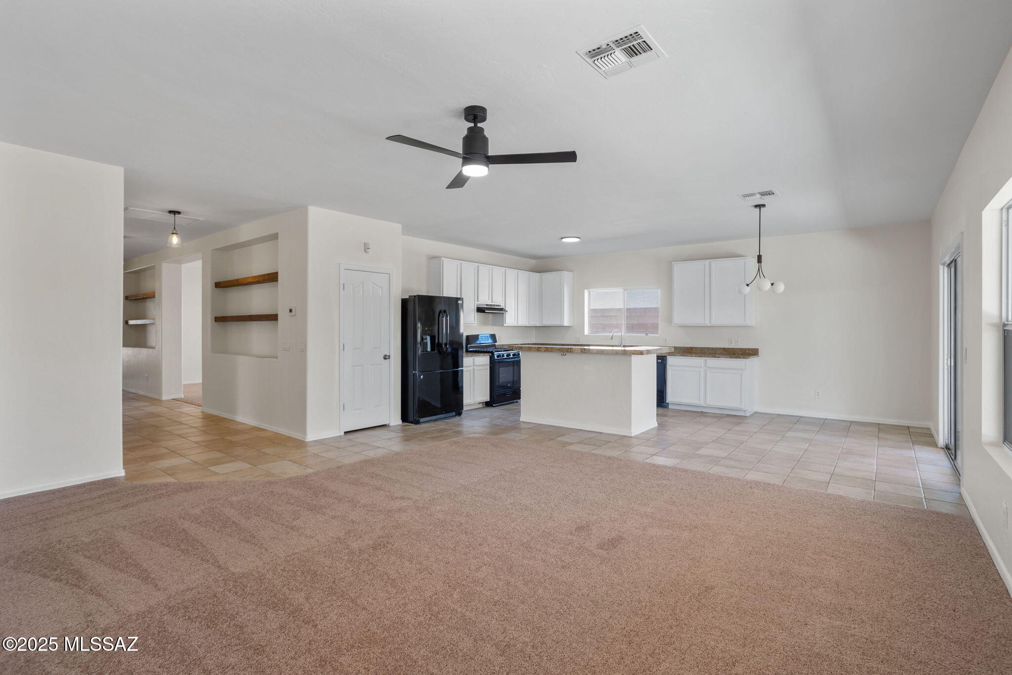 Welcome home to this stunning and immaculately kept 3-bedroom 3-bathroom residence in the serene Tucson Mountain Sanctuary neighborhood! This home has direct mountain views, manicured landscaping, and a 2 car garage. Upon entering you'll enjoy the soaring high ceilings, wide hallways, and foyer. Also features an ample and versatile grand room which could be used as an entertaining area/dining area/home office. With modern upgrades throughout, this home seamlessly blends comfort and style. Enjoy the convenience of the indoor laundry, an open concept, and split floor plan. With the heart of the home being a beautiful kitchen with natural wood cabinets, high end granite, eat-in island, and pantry. The huge primary easily fits a king bed, has a cooling fan, its own access to the exterior, and white cabinetry, high end exposed granite, stylish black pulls, an eat-in island, sleek black appliances and a pantry. The extended length and roomy primary easily fits a king bed, has a LED ligted cooling remote control fan, its own access to the exterior, and dual closets for the owners. Also a fully upgraded oasis of a bath with upscale dual bowl sinks embedded in granite and walk in shower to relax in.. Enjoy your large End-to-End Covered Patio, privacy brick fence, and Tumbled Travertine fire-pit in the Backyard. The home Backs to Natural Desert w/View Fencing, lovely Mountain Views, and gorgeous sunsets. With close proximity to Desert Museum, Old Tucson, shopping center, and Ajo highway. This home is a Must See! Make it yours TODAY! Owner/Agent