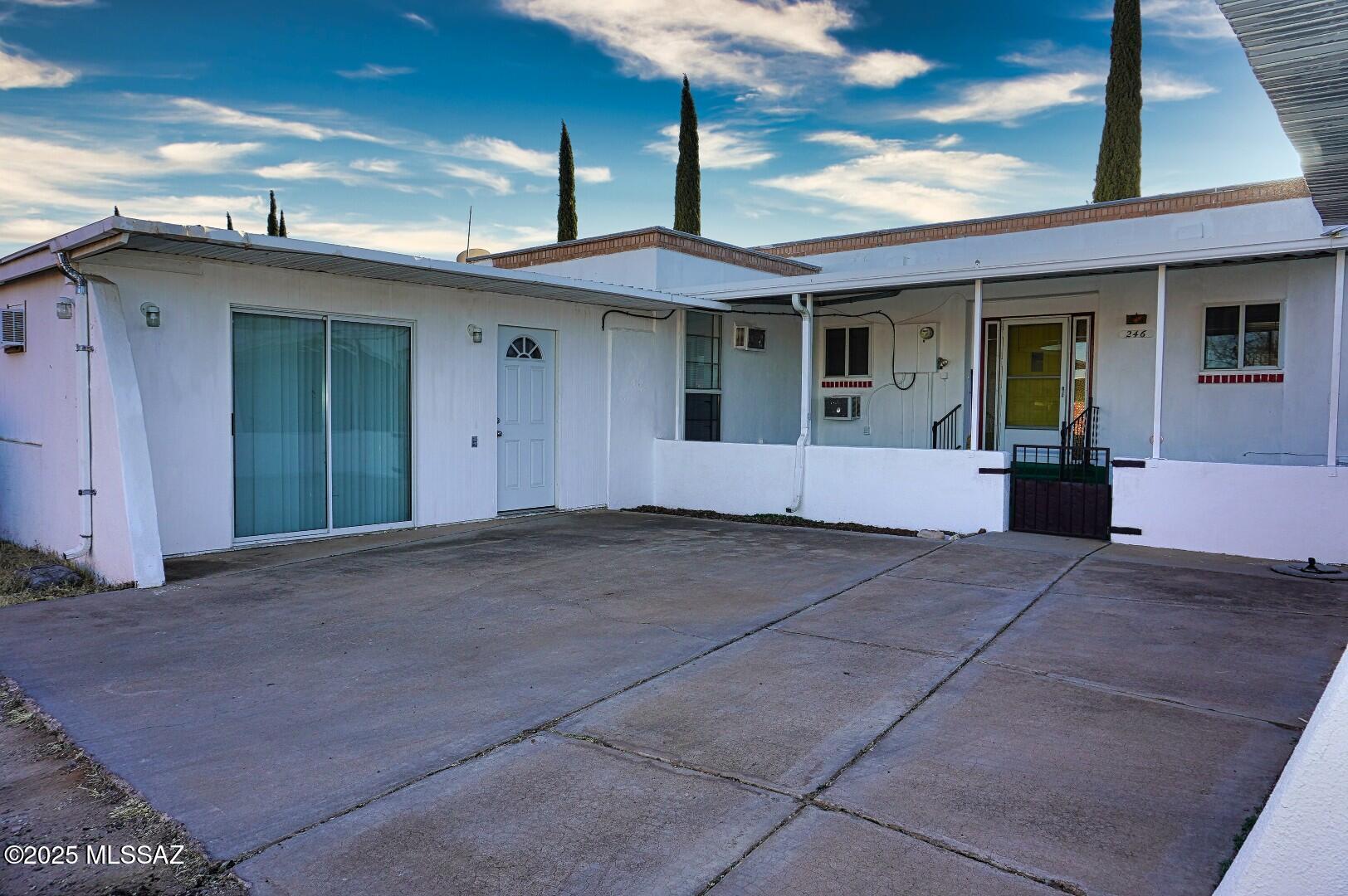Move in ready large townhouse in Pearce/Sunsites. Light and bright with great Cochise Stronghold views from the front, covered patio. This home also has a large work shop in the back with power, AC and baseboard heat. Wood burning Fireplace in the great room. 
Large master bedroom. Split floor plan. AZ room is not incl. in the sq footage. AZ Room goes along the whole West side of the home and lets lots of light in. Washer dryer and Fridge convey. Parking out back or in the front. Large covered front and back patios. Fiber optic internet avail.