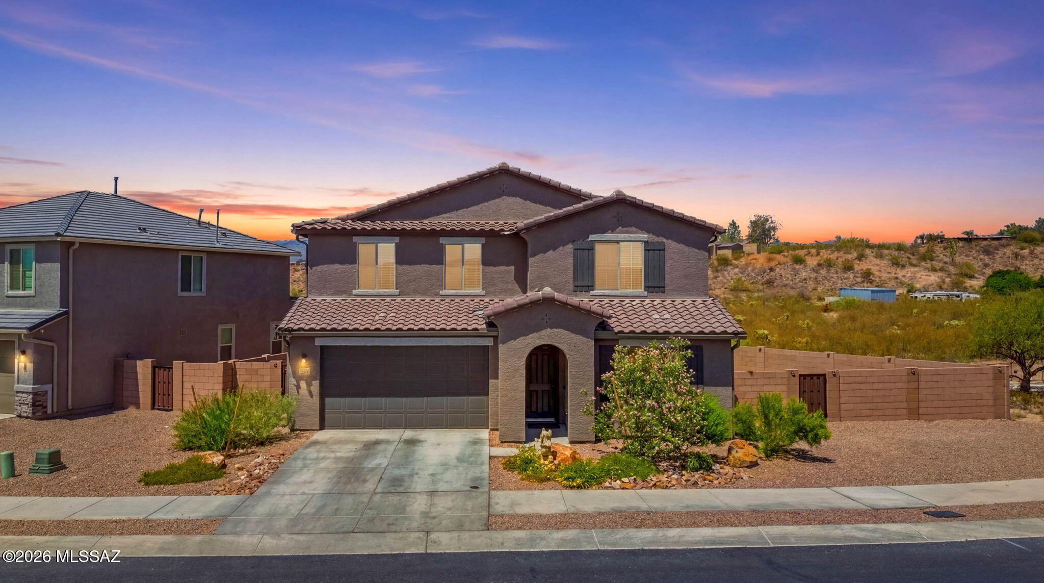 Built in 2024, this beautifully designed home in the desirable Vail community offers a versatile layout perfect for modern living. The main floor features a private guest suite with its own living area and full bath, ideal for multi-generational living or visitors. The open-concept great room flows into a spacious kitchen with a large island, walk-in pantry, and sliding glass doors leading to the covered patio. Upstairs you'll find a loft, three secondary bedrooms, full bath, laundry room, and a luxurious primary suite with an oversized walk-in closet and private bath. Conveniently located near top-rated Vail schools, parks, shopping, and dining. Move-in ready and better than new!