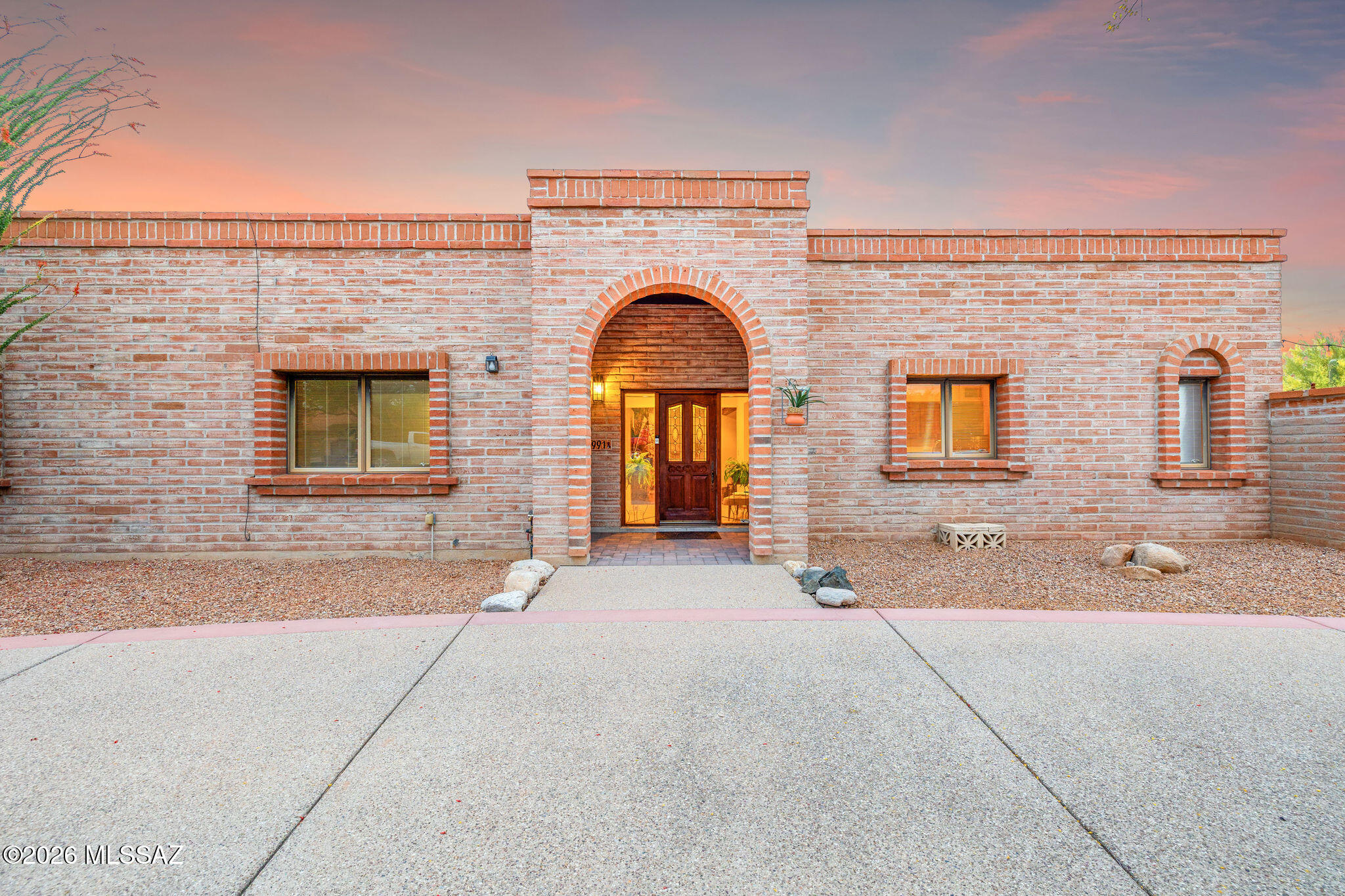 There are homes... and then there are properties that quietly set the standard for what living in the foothills is supposed to feel like. This is one of them!

Tucked into the highly coveted enclave of Shadow Hills--where walkability meets some of Tucson's most breathtaking mountain views--this exceptional masonry estate tells a story of pride, intention, and elevated everyday living. From the moment you arrive, there's a sense that this home has been thoughtfully curated, not just maintained.

Inside, the layout flows effortlessly, anchored by a spacious kitchen that opens seamlessly into the main living areas--designed for connection, conversation, and the kind of gatherings that linger well into the evening. Natural light pours in, while the home's solid masonry construction (contin adds a quiet sense of permanence and quality!

The primary suite is a true retreat, expansive in scale, featuring a massive walk-in closet and a spa-inspired bathroom that invites you to slow down and recharge! It's the kind of space that feels more like a private resort than a bedroom.

Step outside, and the home truly comes alive.

A deep, north-facing covered patio creates the perfect extension of the indoor living space--cool, shaded, and ideal for year-round entertaining! Beyond it, the backyard unfolds into an entertainer's dream including a sparkling pool, private basketball court, putting green, and multiple areas to gather, relax, and play- all surrounded by a sense of privacy that's increasingly rare!

Guests and family alike are well accommodated, with generously sized secondary bedrooms and a standout feature that sets this property apart: a fully appointed two-bedroom casita, complete with its own kitchen and matching masonry construction. Whether for extended family, visitors, or flexible living arrangements, it's a space that adds both function and long-term value!

And for those who appreciate space for vehicles, hobbies, or storage--the four-car garage delivers in a way few homes in this area can!

Opportunities like this--where location, construction quality, versatility, and lifestyle all align--are incredibly rare in Shadow Hills. This isn't just a home; it's a foothills experience, elevated.

Come see why this one is truly special!
