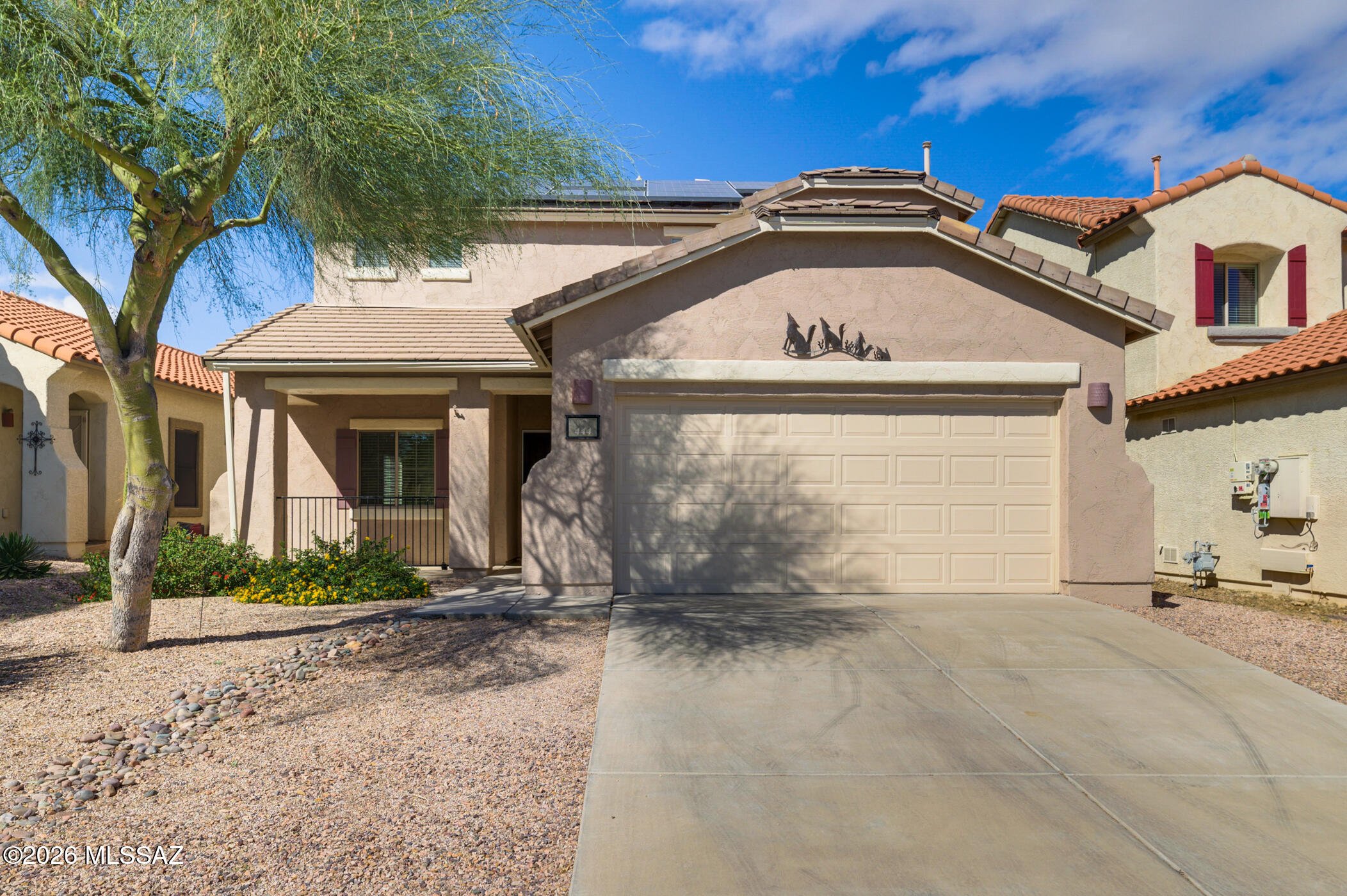 Back on Market Through No Fault of Seller or Home - Buyer's Loan Denied! Their loss is your opportunity to own this beautifully maintained and move-in ready home in the highly sought-after Rancho Sahuarita community. Offering 4 bedrooms, 3 full baths, and a versatile floor plan with a downstairs bedroom and full bath perfect for guests, multigenerational living, or home office use. Upstairs features spacious secondary bedrooms plus a large loft for additional living space. Enjoy energy savings with solar and all the incredible Rancho Sahuarita amenities including pools, parks, walking trails, clubhouse, and lake. Homes like this do not last long--schedule your showing today or visit the Open House Sunday 1-4 PM!