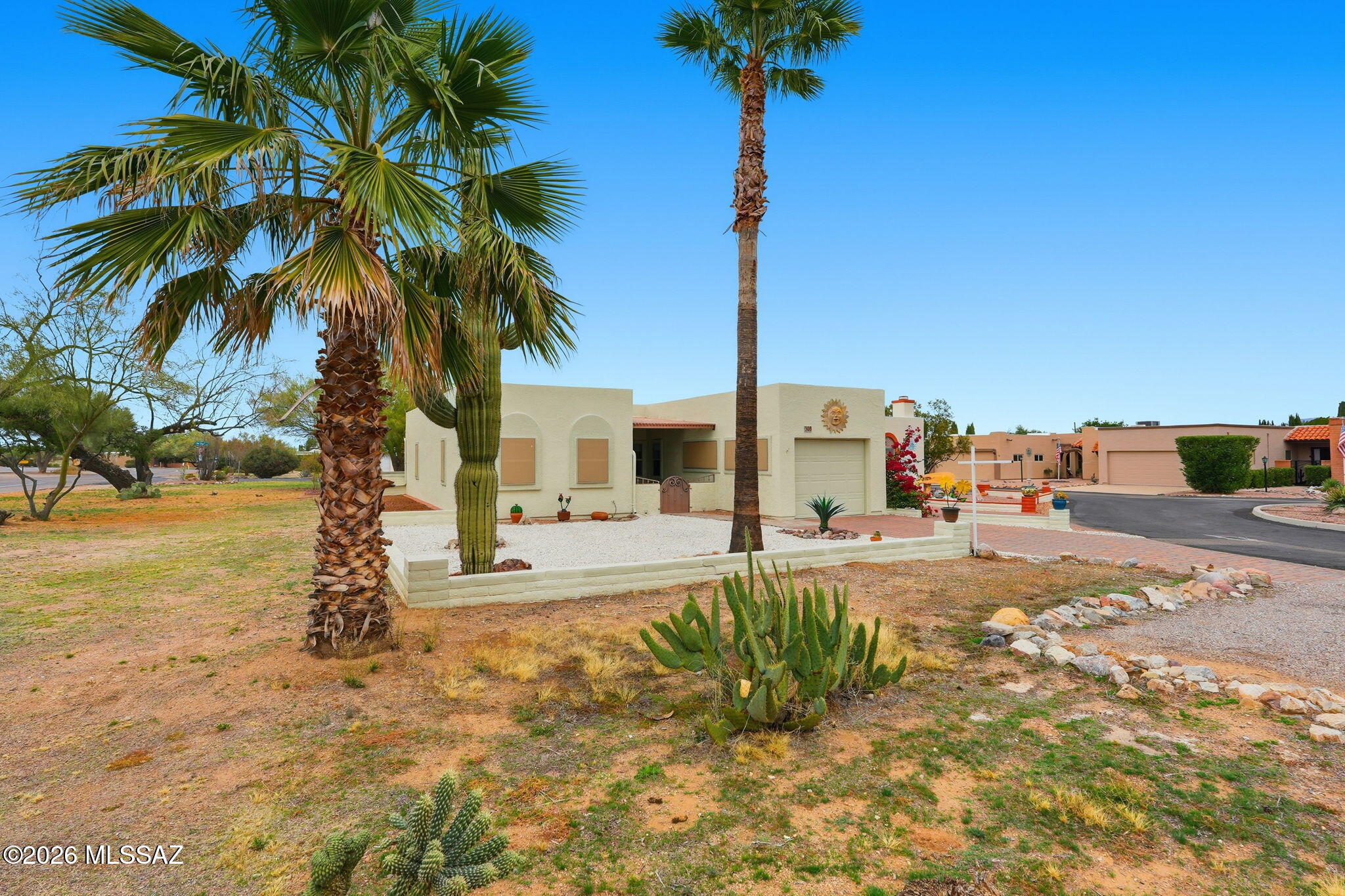 Beautifully-maintained, move-in ready townhome in quiet neighborhood. Comes with all newer appliances, quartz countertops, light, bright
kitchen that sparkles!  Two large bedrooms, each with full baths. Spacious, versatile sunroom w/ walk-in pantry, great for extra storage. Newer air conditioner and heating HVAC  (2021), solar screens (installed in 2024)  for extra cooling and privacy. Newly-painted garage is fully-enclosed and has a new epoxy floor.  Gated fully walled patios at entry and backyard providing a pet-friendly environment.  Handy to GVR pool, arts facility, shopping, restaurants. Safe streets for walking, cycling w/ access to Anza Trail. Easy access to I-19 going in either direction.