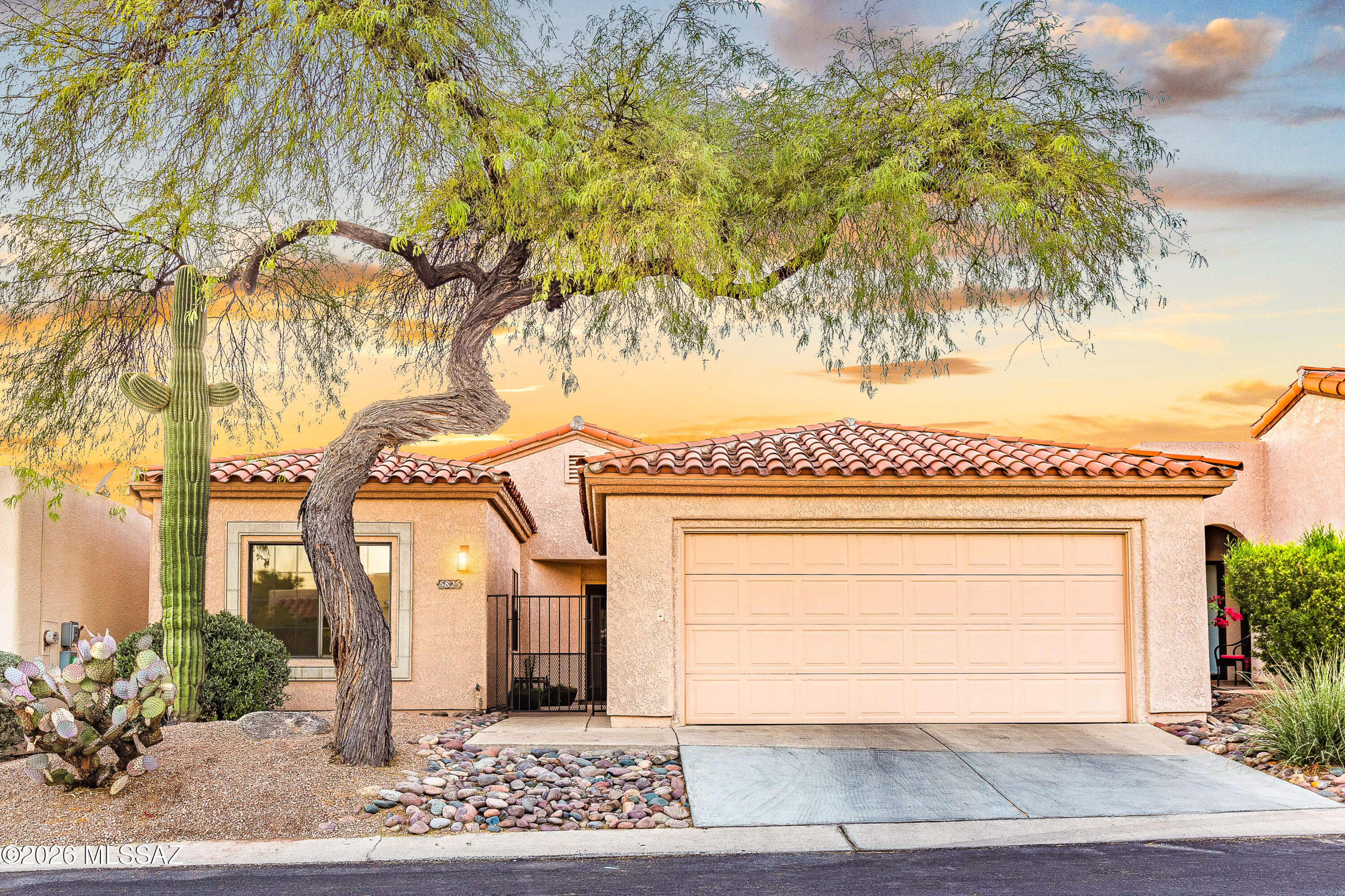 Located within the prestigious gated community of La Paloma, this beautifully updated 2-bedroom, 2-bathroom residence offering 1,442 square feet delivers an exceptional blend of comfort, sophistication, and effortless desert living. Positioned within the exclusive Ridge 4 enclave and surrounded by the fairways of La Paloma Country Club, the home captures the relaxed elegance of the Catalina Foothills lifestyle. Designed with an open great-room floor plan, the interior features soaring vaulted ceilings and expansive windows that fill the home with natural light while framing tranquil desert and mountain views. A cozy gas fireplace anchors the living area, creating an inviting space for both everyday living and entertaining. The thoughtfully upgraded kitchen features quartz countertops, stainless steel appliances, and a gas range, seamlessly connecting to the living and dining spaces. Polished concrete floors throughout add a contemporary architectural aesthetic while providing durability and low-maintenance living.

The primary suite serves as a peaceful retreat with a spa-inspired bathroom featuring a marble double vanity, soaking tub, and separate shower. A comfortable guest bedroom and additional full bath provide flexible space for visitors or a home office.

Outdoors, a private walled backyard with a covered patio offers an ideal setting for relaxing mornings or sunset gatherings, surrounded by attractive, low-maintenance landscaping that complements the natural desert setting.

Additional highlights include a two-car garage and access to the Ridge 4 community pool and spa. The property is located within the highly regarded Catalina Foothills Unified School District, one of Southern Arizona's top-rated districts.

Investment Opportunity: The home currently has a tenant lease in place through April 30, 2027, offering immediate and stable rental income for investors seeking a property in one of Tucson's most desirable foothills communities.

Situated in the heart of the Catalina Foothills, this residence represents a rare opportunity to own within a premier golf community while benefiting from a secure, long-term tenancy and lock-and-leave convenience.