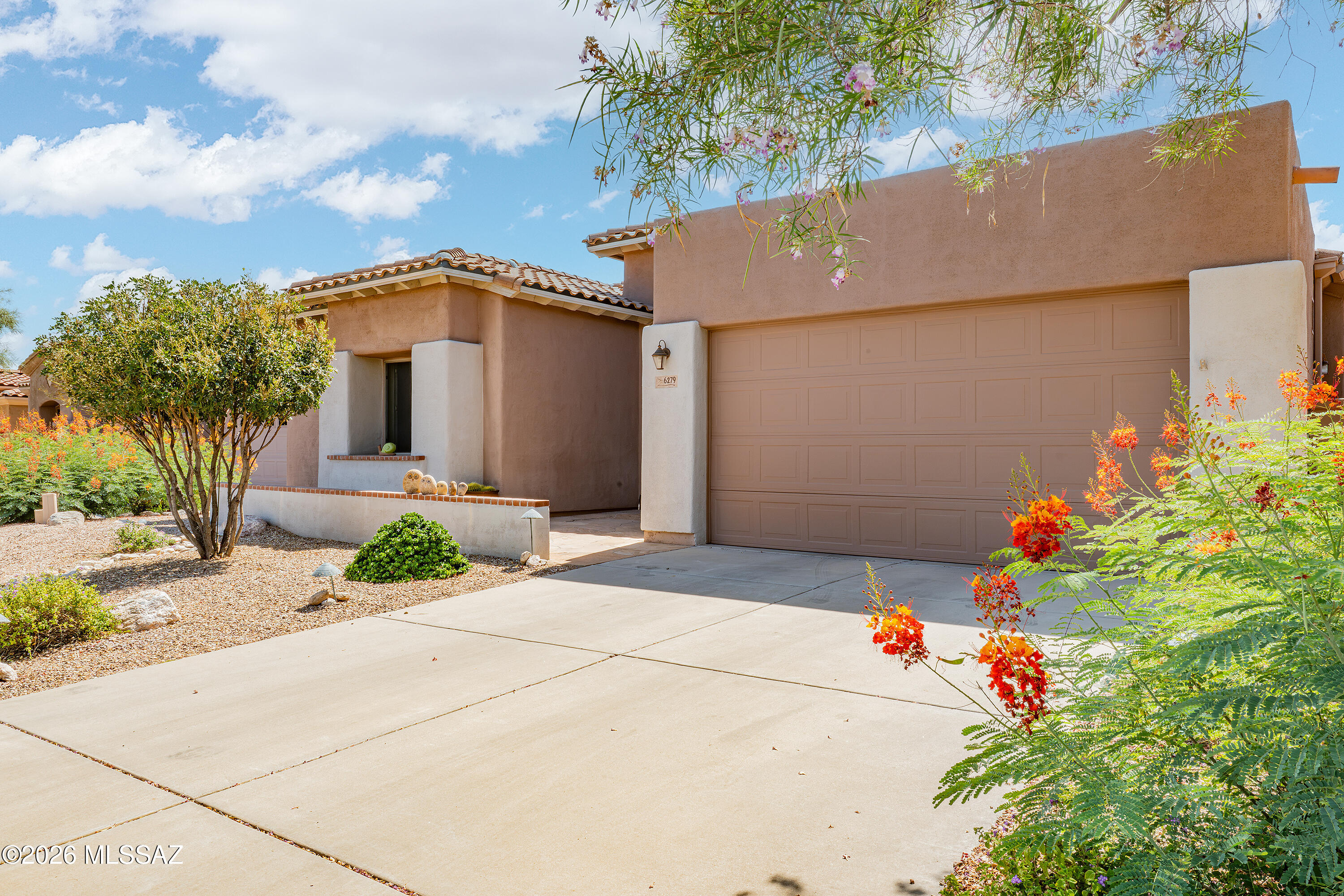 SUPER CUTE, immaculate 2 bed, plus office/den in the BEAUTIFUL, GATED Villages of La Paloma! Enter a lovely flagstone courtyard to a charming, well designed, all one level home, w/ the perfect split floor plan! Bright & open family room w/ high ceilings, niches & cozy gas fireplace. Large kitchen has tons of cabinets, light Corian countertops & newer appliances (gas cooktop) w/ a huge breakfast bar, PERFECT for entertaining! Primary bedroom has 2 large walk-in closets & an ideal bathroom w/ double vanities, large shower & soaking tub! Laundry room w/ built-in desk! The office/den ROCKS w/ shelves galore! Enjoy GORGEOUS sunsets in this delightful, INCREDIBLY PRIVATE, low maintenance backyard w/ BUILT-IN BBQ & fountain! Outstanding, prime Foothills neighborhood & location close to EVERYTHING