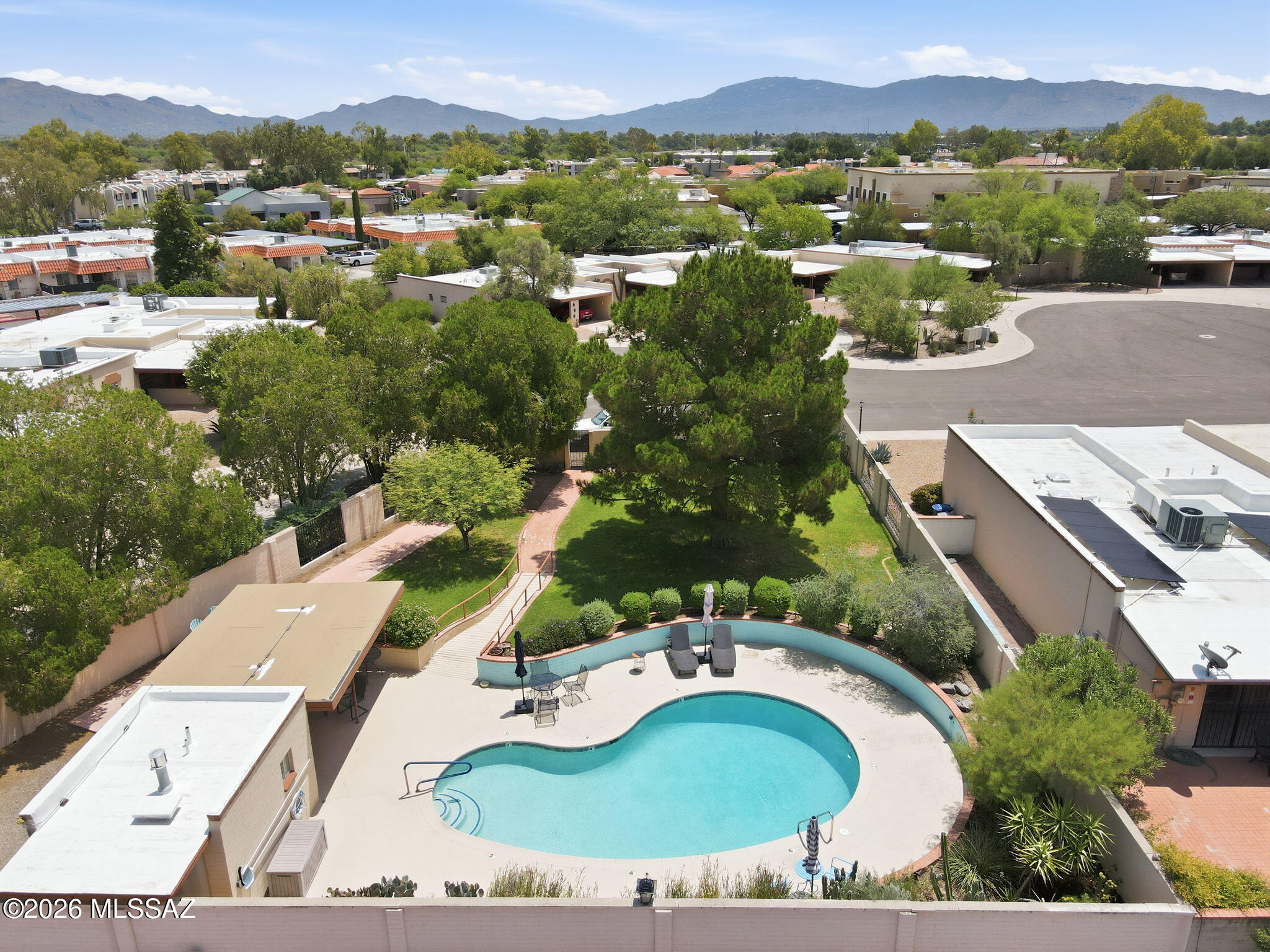 Easy, low-maintenance living in desirable Las Villas De Granada-a premier 55+ community! This beautifully remodeled 2BD/2BA townhome is filled w/natural light & features gorgeous tile flooring, granite countertops, tile backsplashes, updated finishes, newer appliances & other stylish touches throughout. Spacious, highly usable living area is perfect for relaxing or entertaining, while the inviting Arizona room w/cozy gas fireplace adds even more functional living or office space. Lg kitchen w/lots of cabinet space, good-sized guest room & huge primary suite! The private backyard opens to natural buffer & has only one side neighbor for added privacy. HOA covers water, sewer, trash, front landscaping, irrigation, exterior painting, pool & common area maintenance. Ideal location just minutes from Costco, Trader Joe's, shopping, dining, bus lines, movie theaters, & only 10 minutes from scenic Sabino Canyon & Park Place Mall. This home offers the perfect blend of comfort, convenience & active AZ living. At least one buyer must be 55 years of age or older.