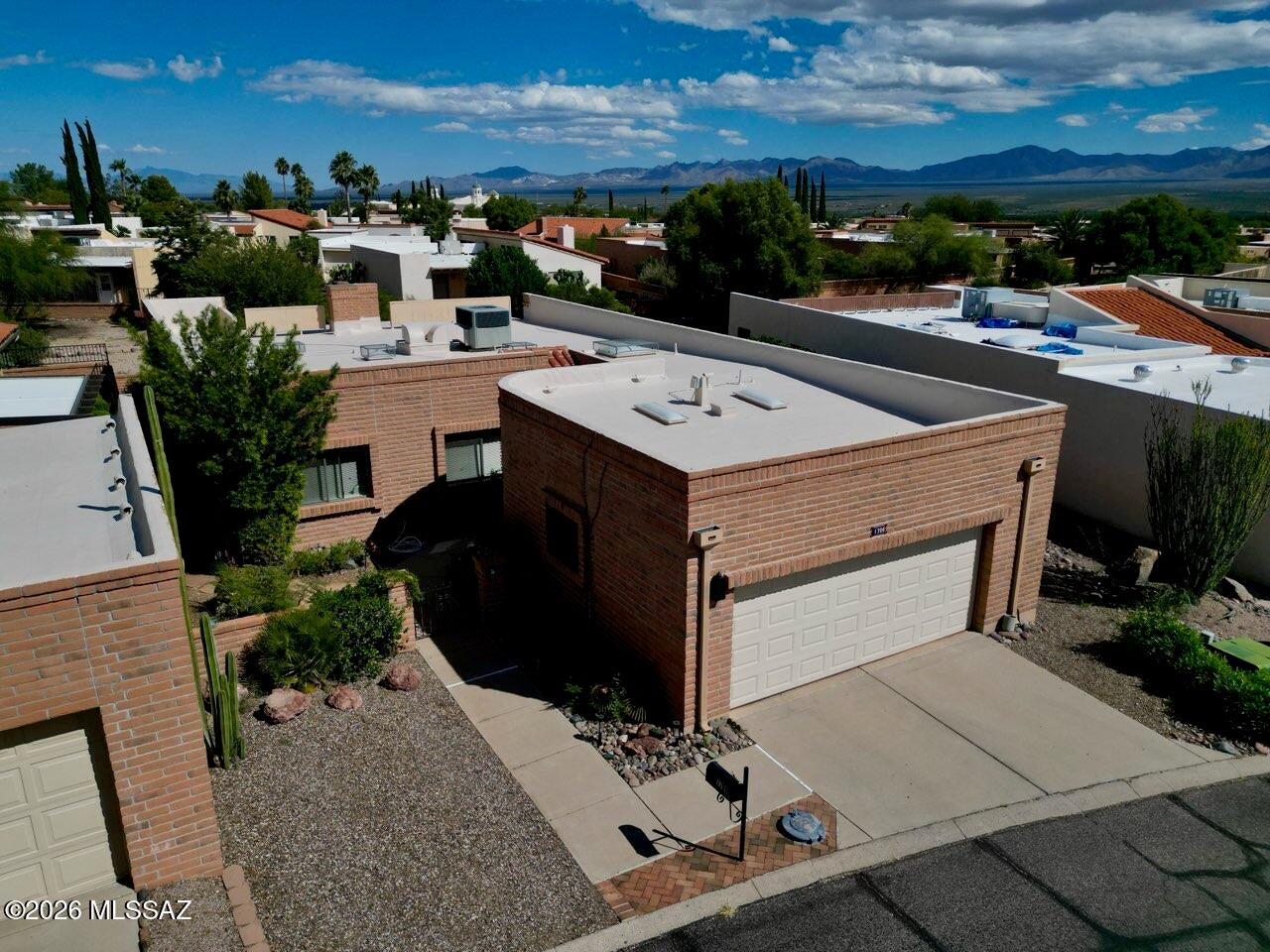 Welcome home to 1706 W Retorno de la Manana, a beautifully updated 2-bedroom plus den, 2-bath home in a wonderful 55+ neighborhood. The kitchen and both bathrooms have been tastefully remodeled, and big-ticket items are already done: HVAC system in 2023, a roof recoat in 2026, and a new skylights with hail protection covers. The den gives you room for a home office or hobby space. Outside, enjoy lovely mountain views and a large side yard with natural landscaping. Beyond the back fence, a common area draws plenty of desert wildlife for your enjoyment. The spacious 2-car garage includes a utility sink, and an extra parking spot in the front yard is handy for guests or a golf cart. Membership in Green Valley Recreation gives you access to pools, fitness centers, classes, and clubs.
