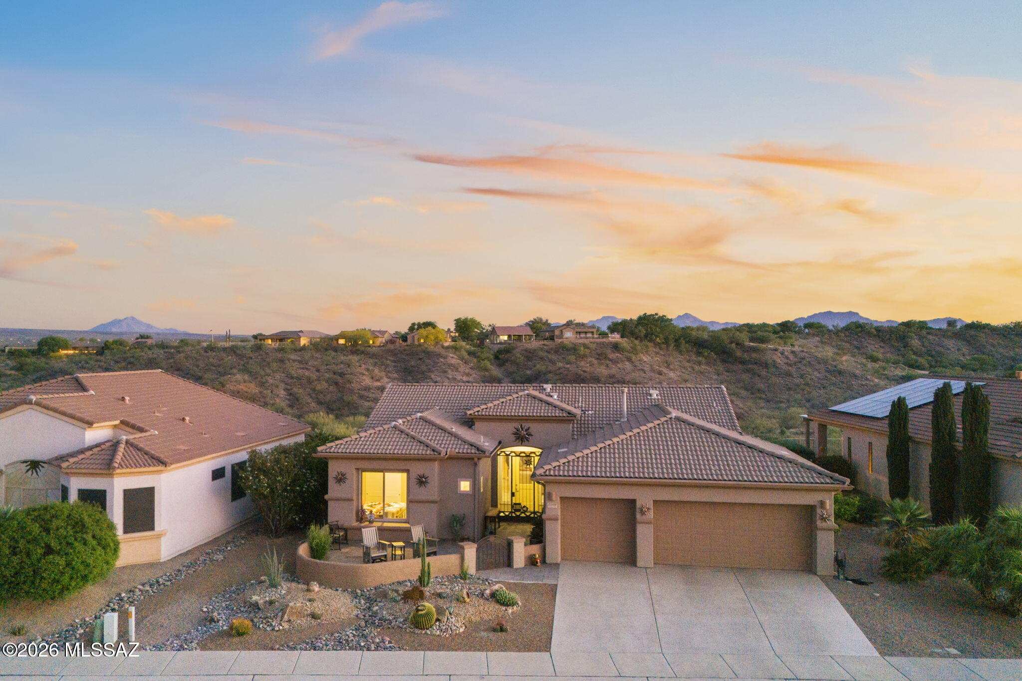 Experience the spectacular views of Madera Canyon, Elephant Head Mountain and the Majestic Santa Rita Mountains from this recently renovated 2-bedroom, den/office, 2-bath, open-concept home in the gated community of Canoa Northwest.  Located in picturesque Green Valley, this home boasts new windows, doors and flooring throughout the entire house as well as recently installed high-end cabinets, countertops, and Bosch appliances.  The heating and cooling systems were replaced less than two years ago along with the water softener system. A roof underlayment was installed in 2026. Other perks of this home include an over-sized, three-car garage with mini-split HVAC unit, front courtyard, beehive fireplace, custom iron gates, solar sun shades, and fenced yard overlooking the 13th green on CRGC.