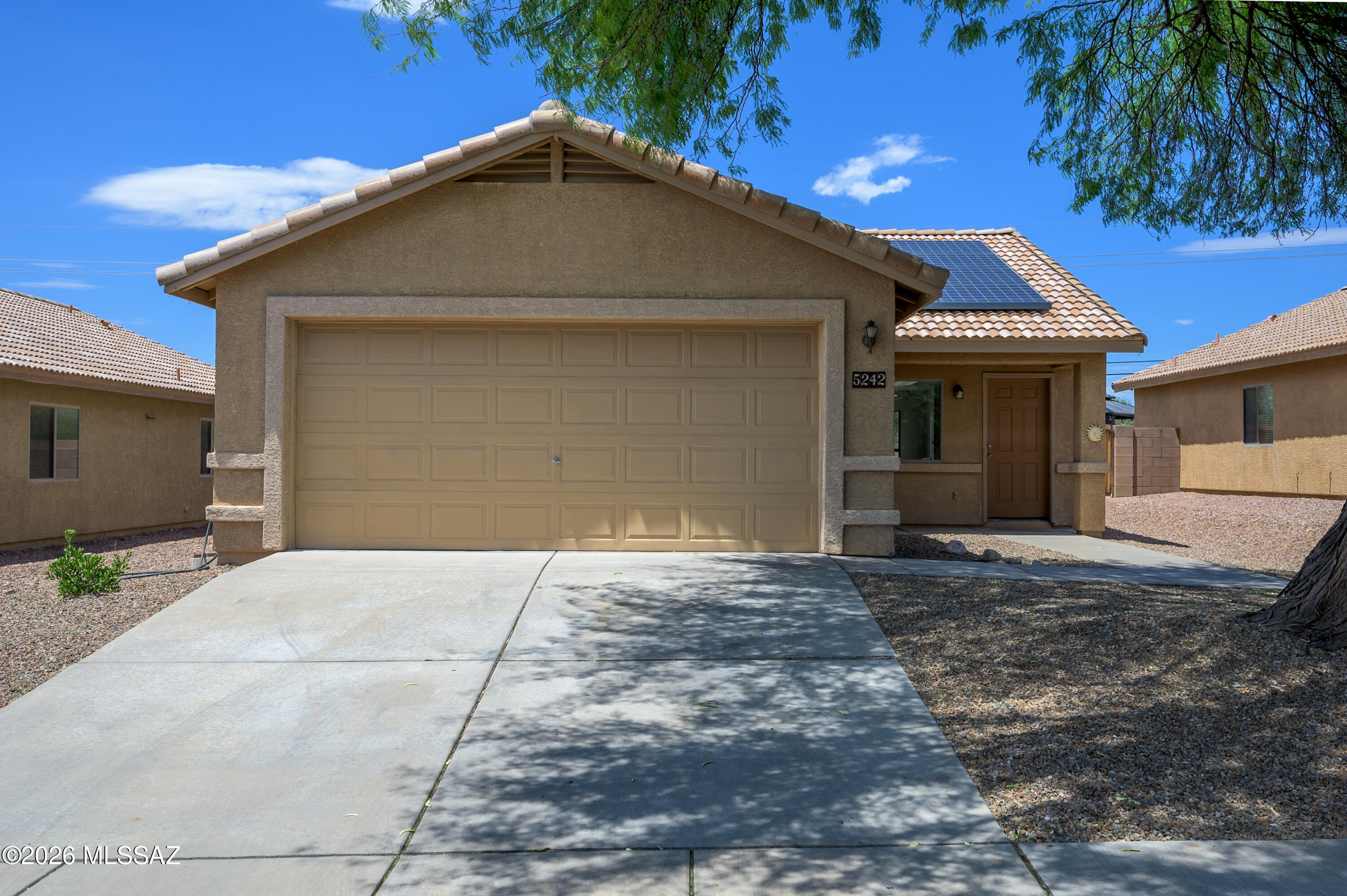 Welcome home! The first thing you'll notice is the beautiful mature shade tree that adds charm and curb appeal. Step inside to soaring vaulted ceilings that create an open, inviting feel from the moment you walk through the door. Fresh interior paint and an abundance of natural light make this home feel bright and welcoming. This three bedroom, two bathroom home offers a functional layout designed for everyday living. The spacious primary suite features a walk in closet and private ensuite. Enjoy the privacy of having no rear neighbors, plus the convenience of a spacious two car garage. Ideally located near shopping, restaurants, and easy access to I-10, this home offers the perfect blend of comfort, convenience, and value. Schedule your private showing today!