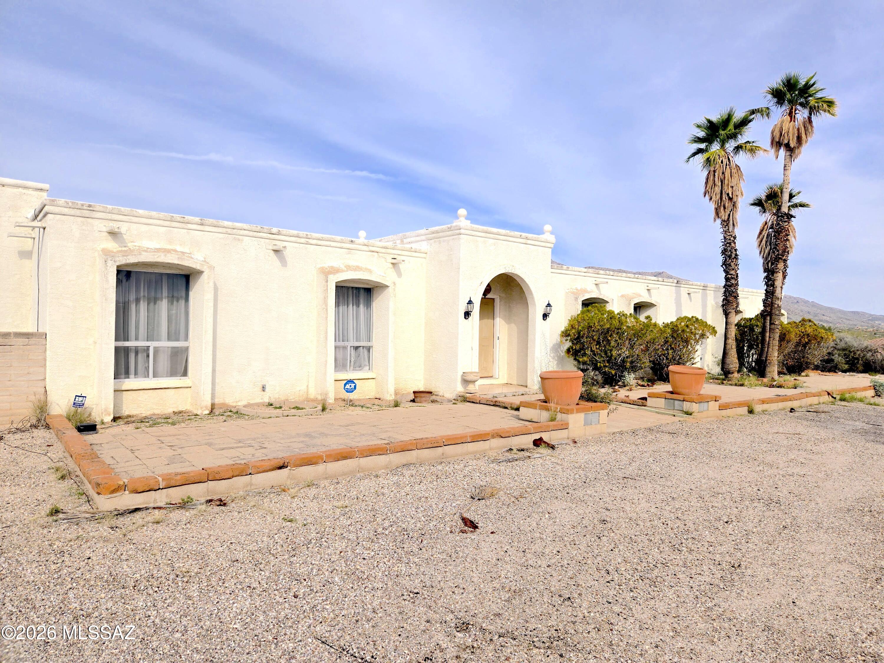 PRICE REDUCED $50,000!!! Incredible investment opportunity in the Catalina Foothills! Home features 2 bedrooms, 2 bathrooms and 3,077 sq ft with two car garage. Located in a quiet and private cul-de-sac with great Santa Catalina mountain views. Large sunken living room and family room. Home has a large Arizona room. Huge .75 acre lot. With room to expand or add a pool. Lots of room to make this property exactly how you want it inside and out! Needs TLC but with the right owner will be a fabulous place to call home!