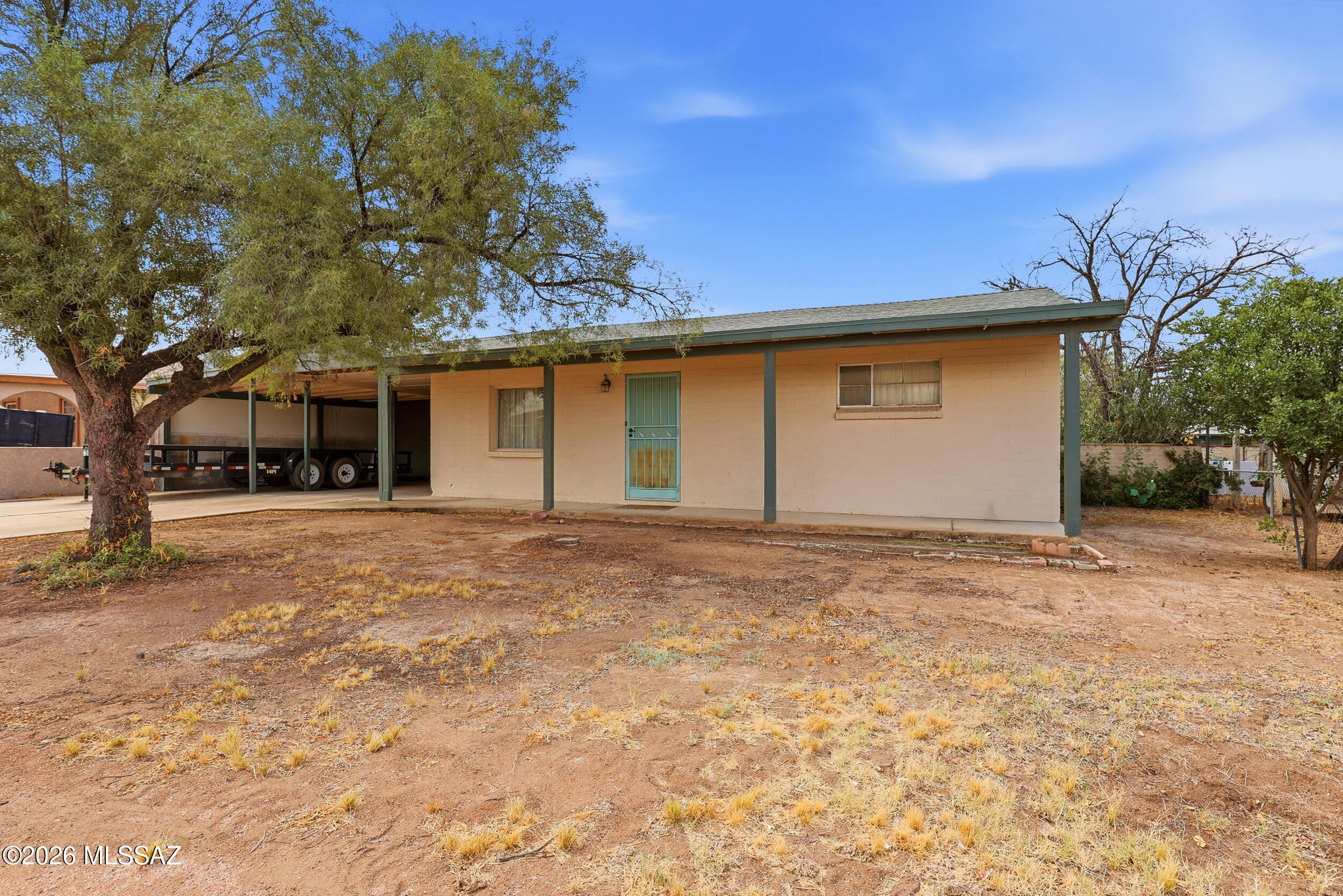 This spacious 3-bedroom, 2-bath block construction home offers an incredible opportunity to create your dream property in a convenient location. With over 1,850 square feet of living space, generous room sizes, and a large lot, there's plenty of room to customize, expand, and add value. The oversized primary suite provides space for a sitting area or home office, while the dedicated storage/workshop area adds flexibility for hobbies, projects, or extra storage.

Enjoy added comfort and efficiency with two AC units, helping keep the home comfortable year-round. The expansive backyard offers endless possibilities for outdoor living, entertaining, gardening, or even future additions. A recently installed roof provides a strong head start for renovations and peace of mind for future owners.

Located just minutes from shopping, dining, entertainment, and the growing attractions around Tucson Spectrum
, this property combines convenience with opportunity. Easy freeway access makes commuting across Tucson simple.

Perfect for buyers looking to build sweat equity or take advantage of renovation financing options to transform the home into their own personalized space. Sold as-is with outstanding potential for investors, first-time buyers, or anyone looking for a value-add opportunity.
