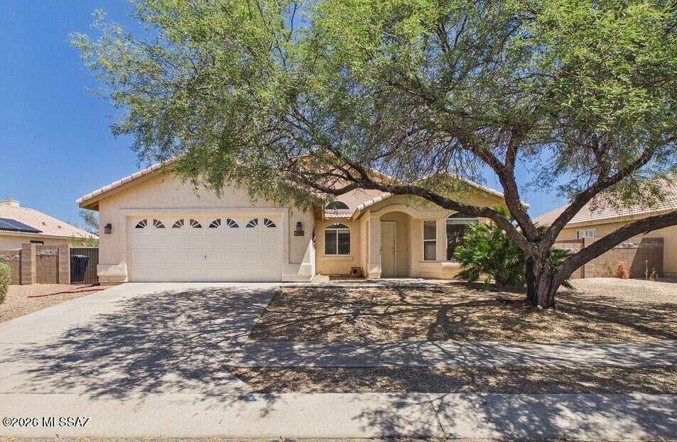 Spacious 1,928 sq. ft. single-story home featuring 3 bedrooms, 2 bathrooms, and brand-new carpet throughout. The thoughtfully designed floor plan offers vaulted ceilings, a bright and open living area, and a spacious family room with a cozy gas fireplace.
The kitchen includes abundant counter space and a breakfast nook, flowing seamlessly into the main living area. The primary suite features a walk-in closet and private ensuite bathroom, while two additional bedrooms provide flexibility for guests, a home office, or hobbies. A standout feature is the upgraded home office, perfect for remote work or a personal library. Enjoy mountain views from the backyard, along with the convenience of a 2-car garage and covered parking. Located in a quiet Tucson neighborhood close to schools, shopping, dining, and entertainment.