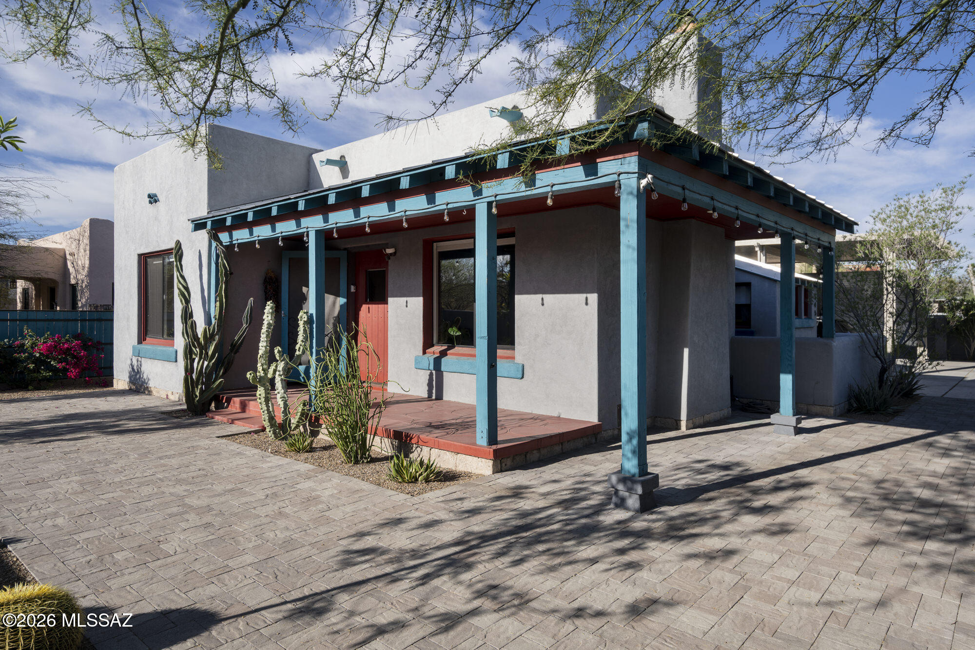 Updated bungalow in historic Rincon Heights, just steps from the University of Arizona. Extensively renovated in 2020 and well maintained by the current owners, this 2-bedroom, 2-bath home offers 1,158 square feet of comfortable living with a bright, modern interior. Features include beamed ceilings, built-ins, ceramic plank flooring, and abundant natural light throughout.

The kitchen is both warm and functional, with flush-front wood cabinetry, quartz countertops, stainless steel appliances, and bar-top seating. The bedrooms are spacious and inviting, including a primary suite with an ensuite bath and walk-in closet. A laundry closet with stackable washer and dryer adds convenience, along with additional storage. Outdoor spaces include two patios, one just off the dining and kitchen area for morning coffee or outdoor dining, and a covered front patio that offers a comfortable spot to enjoy the late-day shade and sunset views. The fully walled and fenced property provides privacy, security, and strong curb appeal. A tall 2-car carport offers flexibility for parking and storage, and there is also a separate garage and storage area.

Blending historic character with thoughtful modern updates, this home is ideally located near the University of Arizona, the streetcar, downtown, and the bike path. Whether you are looking for a primary residence, an investment property, or a home for a student attending the university, this move-in-ready property offers an excellent opportunity in a prime central location.