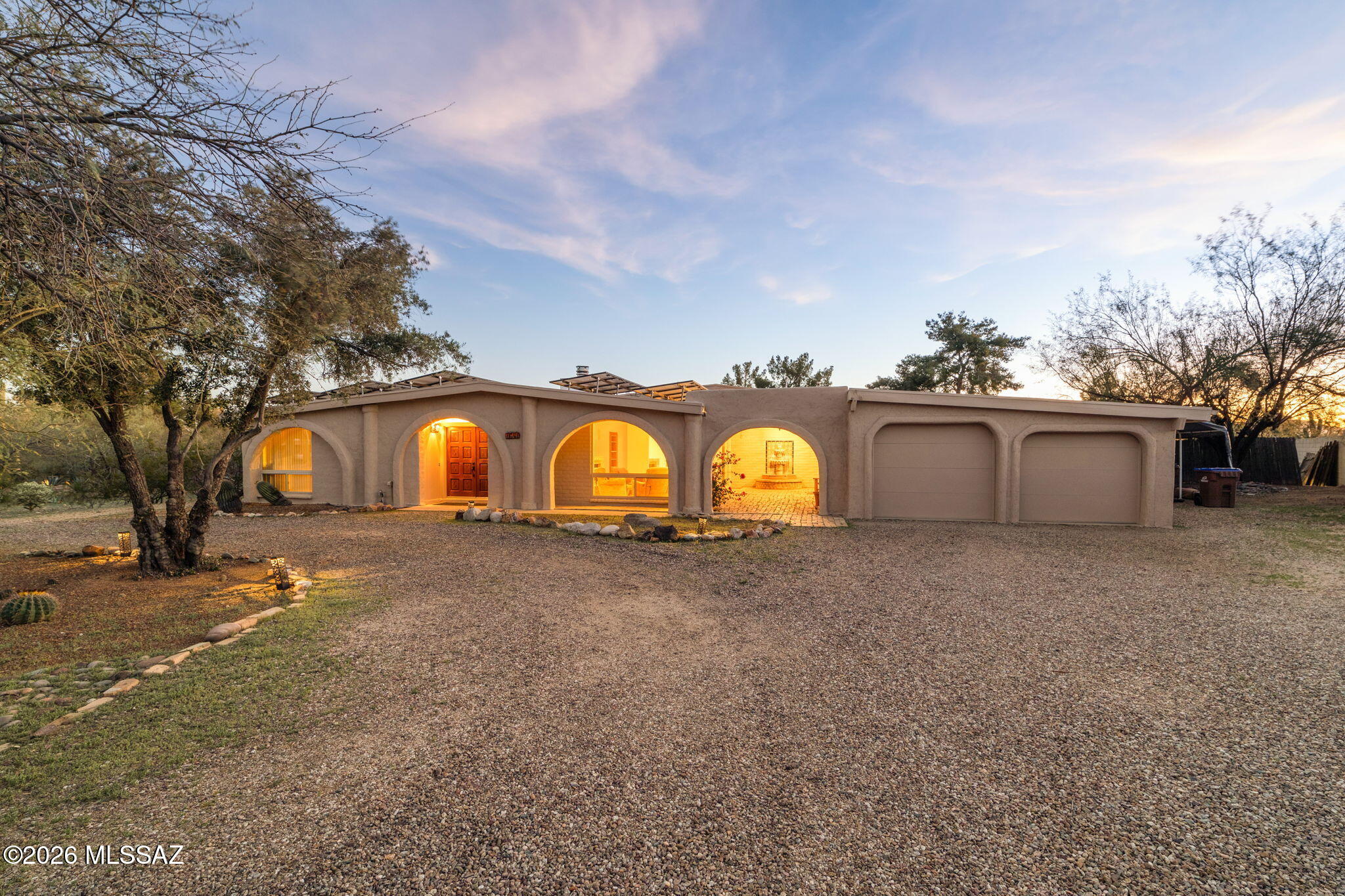 Discover the perfect blend of space, style, and comfort in this well-maintained 5-bedroom home, featuring high ceilings and striking Mexican tile floors throughout. Set in a quiet, highly desirable neighborhood with stunning mountain views, this residence offers a serene Southwest lifestyle on a generous lot of just under an acre. The well-appointed kitchen is a chef's dream, showcasing granite countertops, stainless steel appliances, and a cozy breakfast nook just off the kitchen--ideal for casual dining and morning coffee. Relax or entertain in style with a double-sided wood-burning fireplace connecting the expansive Arizona room to the main living area, while the formal living room offers its own fireplace, adding warmth, character, and timeless appeal. The primary suite features a newly remodeled bathroom with dual vanities, a walk-in shower, and a large soaking tub, all infused with authentic Southwestern charm. A brand-new fence fully encloses the property, enhancing both privacy and curb appeal. An oversized exterior shed with electricity provides exceptional versatility--perfect for a workshop, studio, or additional storage. Blending comfort, charm, and functionality, this home delivers a true Southwest retreat with space to live, relax, and enjoy the surrounding mountain beauty.
