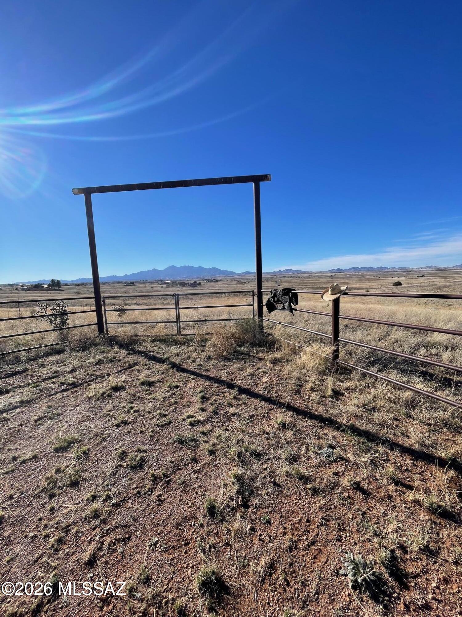 Grassy rolling lot with great mountain views. Fenced and cross fenced in the heart of wine country. Horses or other stock welcome. Ride out the BLM by crossing lower Elgin rd. 
Private well with power to the lot corner. Windmill is only used as lawn art. Several  higher ground homesites for better views. The lot borders condemned RR right of way. Allowing for possibly bring primary drive in off lower Elgin rd. The RR area has been fenced and had been used for grazing.
