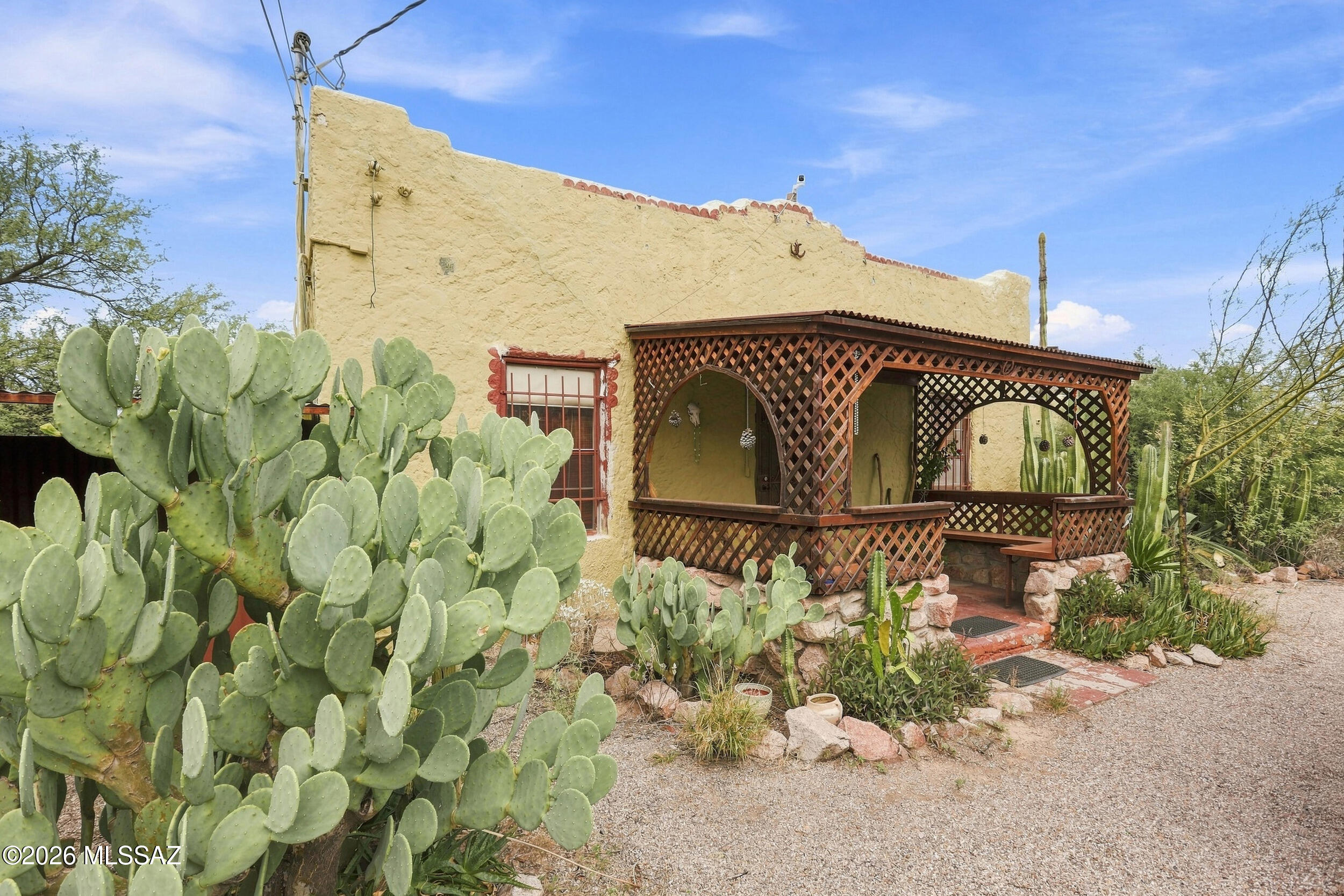 Set on approximately 1.5 acres of flat, usable land on Tucson's desirable west side, 1804 S Santa Cruz Lane presents a unique opportunity for a buyer with vision. Backing directly to the Santa Cruz River, the property offers an uncommon setting with generous space, privacy, and tremendous potential.

The home has solid bones but requires attention. Offered at a price reflective of its current condition, this is an opportunity to reimagine the property and create something truly special. Whether renovating the existing residence or exploring the possibilities offered by the expansive lot, the property provides a compelling blank slate in a distinctive Tucson setting. This is a cash-only or private-financing sale and is being offered strictly in its current condition. With approximately 1.5 acres of usable land, a unique setting, and tremendous potential, this property offers an opportunity increasingly difficult to find on Tucson's west side.