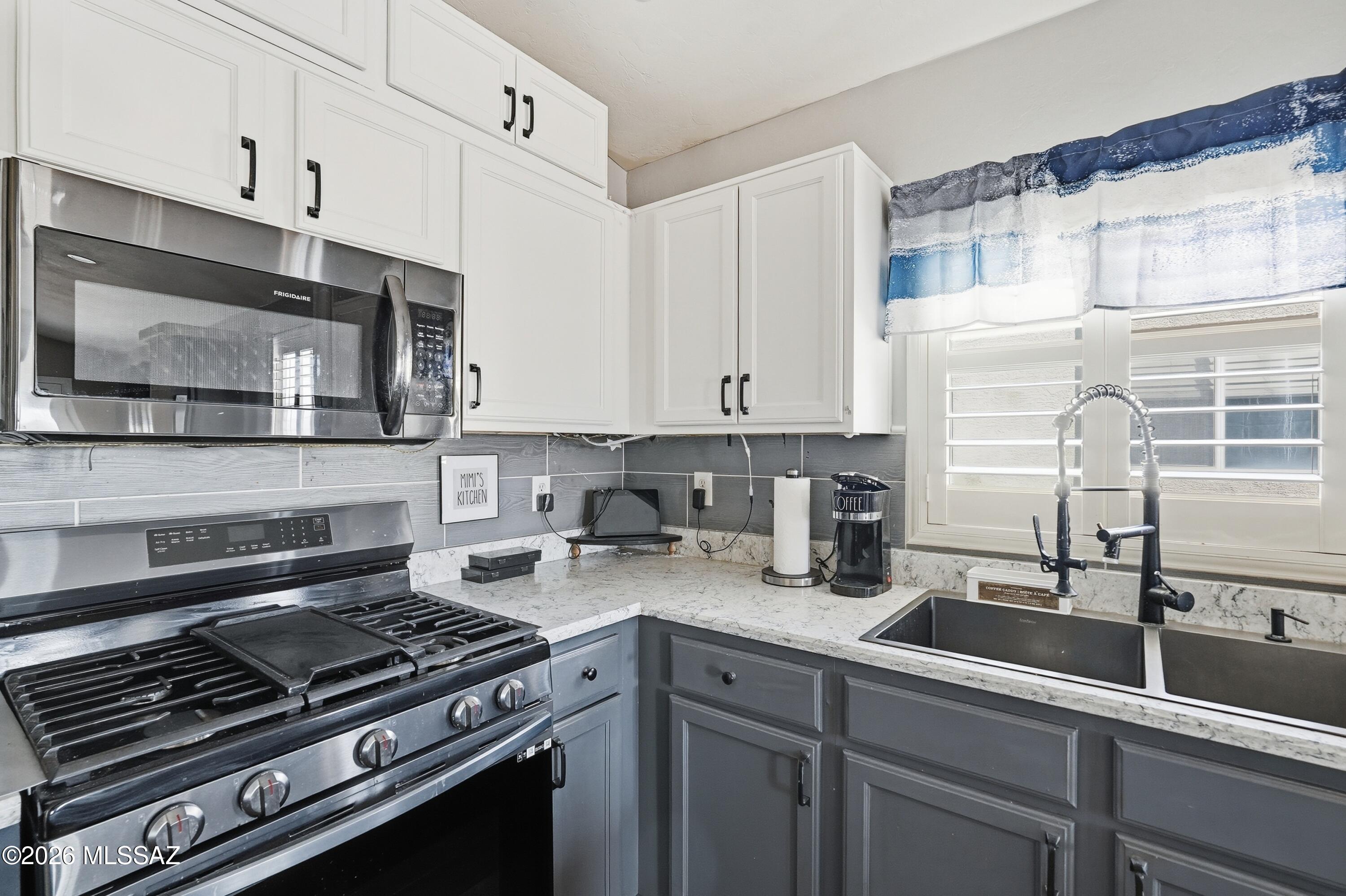 Range pricing: Seller to counter or accept offers between $324,500.00 - $335,000.00.  Welcome to this charming 4-bedroom, 2-bath home in the desirable Gladden Farms community in Marana. Offering 1,873 sq ft of comfortable living space, this home features a functional open layout with spacious living areas and abundant natural light. The kitchen flows seamlessly into the main living space, making it perfect for everyday living and entertaining. Step outside to enjoy the backyard with beautiful views of the Tortolita and Catalina Mountains ideal for relaxing Arizona evenings. Located near community parks, walking paths, schools, shopping, and dining, this home offers the perfect blend of comfort, convenience, and scenic desert living.