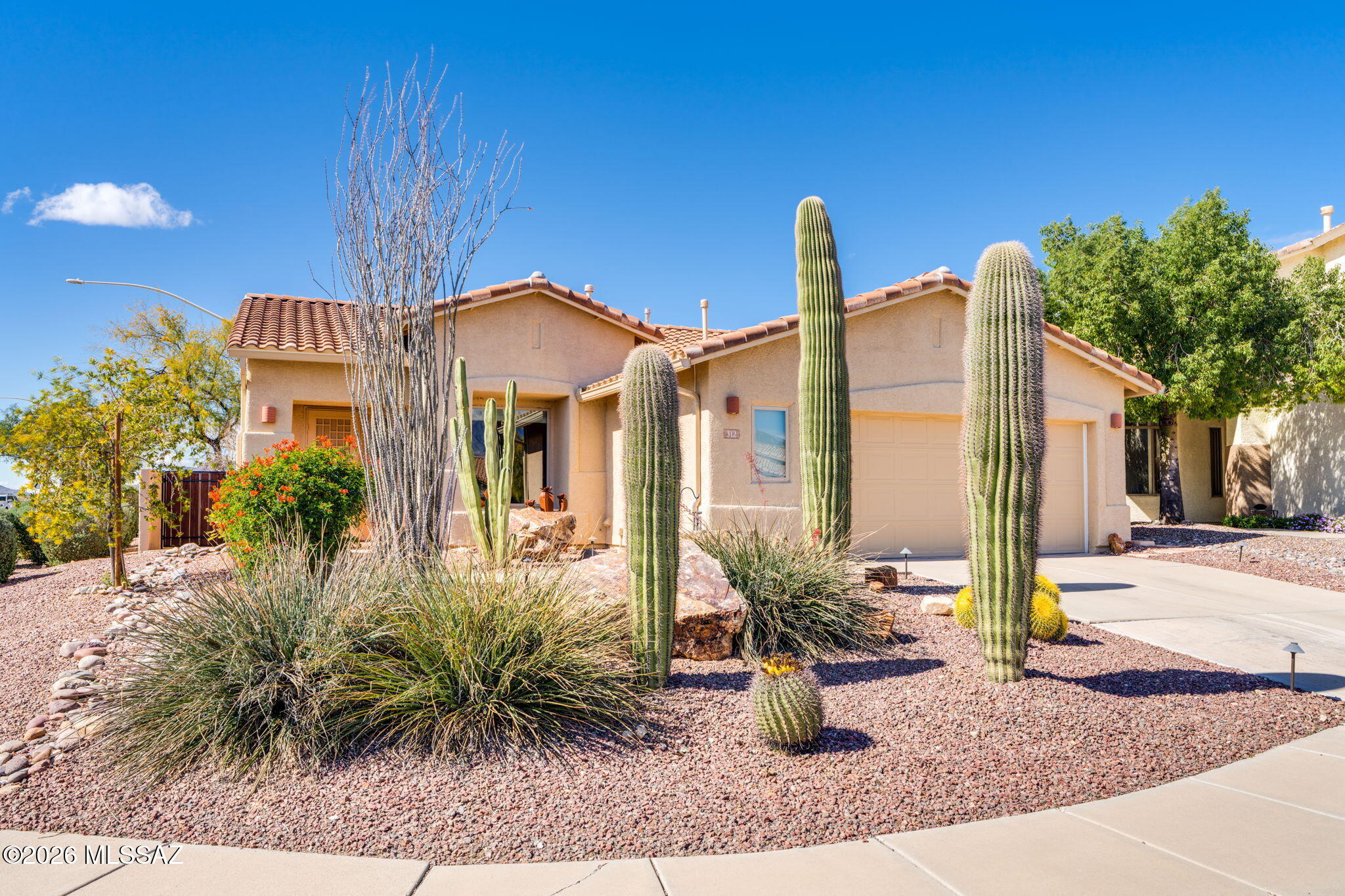 Stunning completely remodeled 2BD/2BA + Den home (1,997 sq ft) in a private gated community. Open floor plan w/ a spacious & bright great room featuring a gas fireplace & travertine floors. The gourmet kitchen boasts granite counters, 6 burner Café stove, breakfast bar w/ electric popups, walk-in pantry & cabinets w/ custom copper hardware. Large primary suite w/ sitting area, built-ins, walk-in closet, dual sink vanity & walk-in shower. Adjacent den w/ access to the private side yard patio. Guest bedroom w/ Murphy bed & updated hall bath. Roof 2020, HVAC 2023, Milgard Sound & Security windows 2022, exterior painted 2026. Enjoy the exceptional outdoor oasis w/ dragon glass gas fire pit, built-in BBQ & extended patio. Located minutes from walking paths, shopping, dining & amenities.